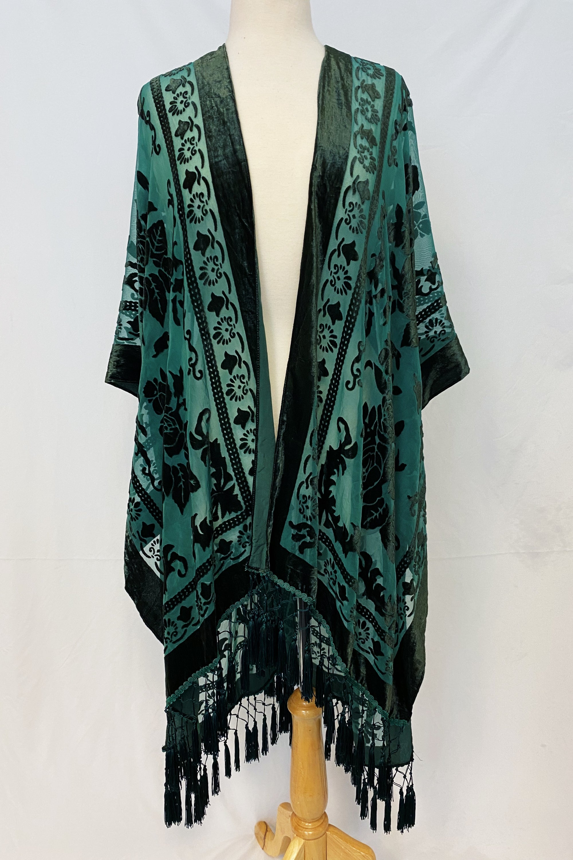 Elegant Boho Burnout Kimono featuring fringed bottoms and velvet details, showcasing its luxurious design and silky tassels.