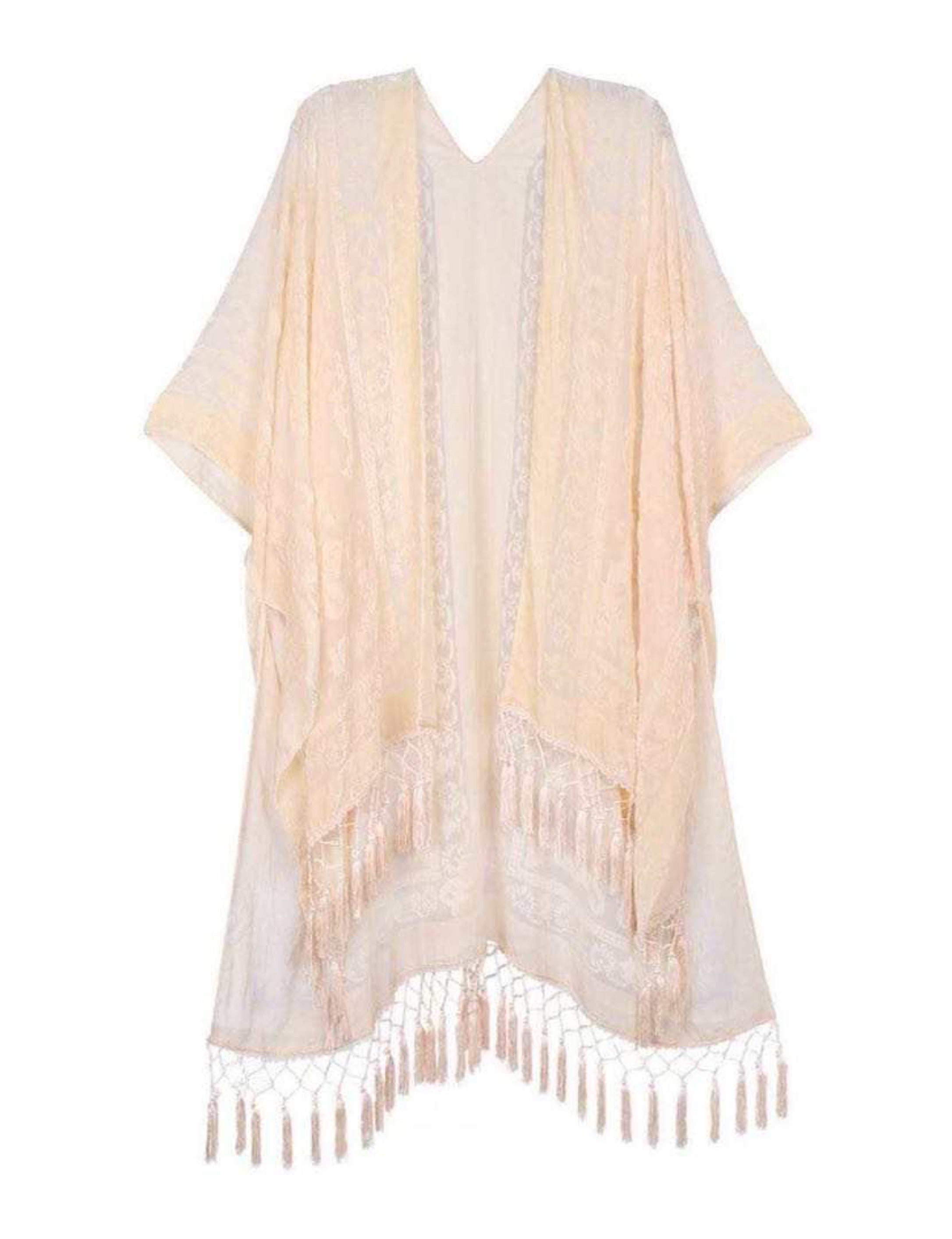 Elegant Boho Burnout Kimono featuring fringed bottoms and velvet details, showcasing its luxurious design and silky tassels.