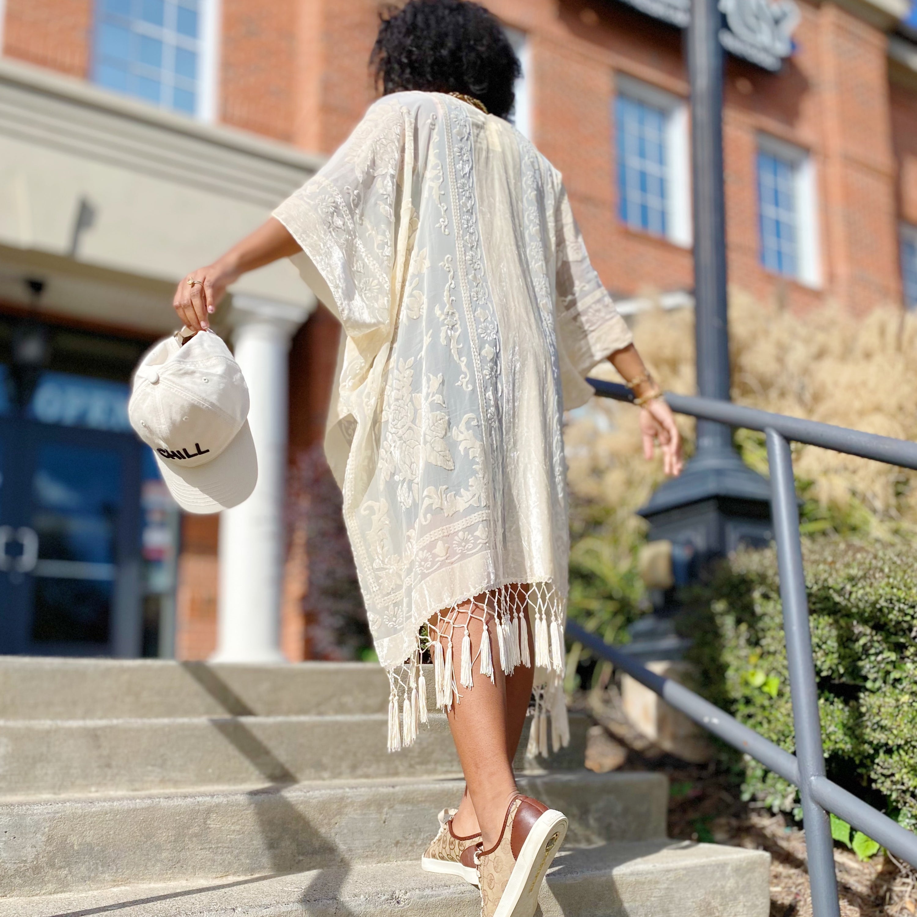 Elegant Boho Burnout Kimono featuring fringed bottoms and velvet details, showcasing its luxurious design and silky tassels.