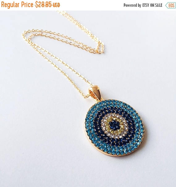 Elegant Evil Eye Necklace featuring a cubic zirconia pendant on a gold chain, symbolizing protection and good luck.