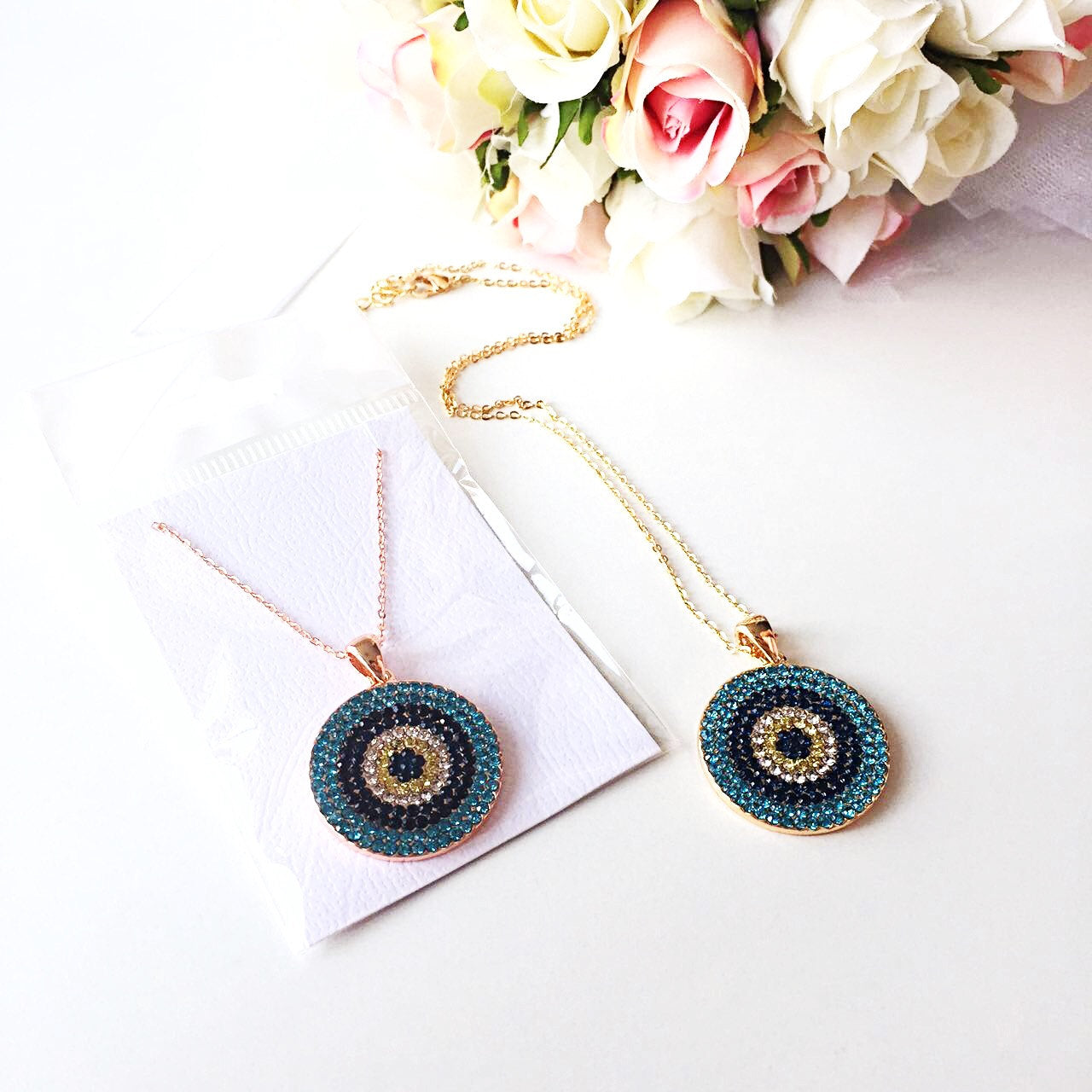 Elegant Evil Eye Necklace featuring a cubic zirconia pendant on a gold chain, symbolizing protection and good luck.