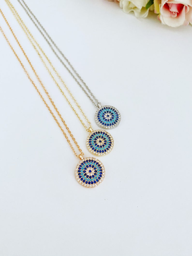 Elegant Evil Eye Necklace featuring a zircon charm on a gold, silver, or rose gold chain, symbolizing protection and style.