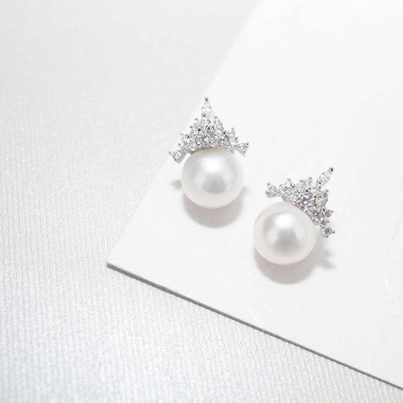 Elegant Freshwater Pearl Earrings WE00171 featuring round white pearls and sterling silver with gold plating.