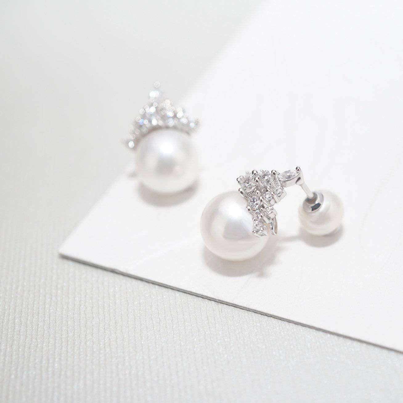 Elegant Freshwater Pearl Earrings WE00171 featuring round white pearls and sterling silver with gold plating.