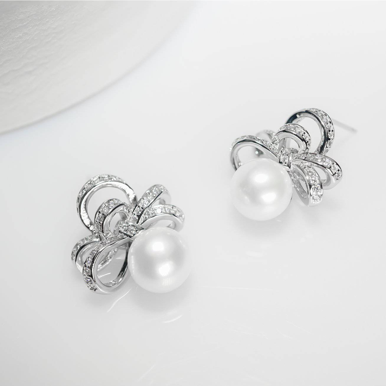 Elegant Freshwater Pearl Earrings featuring high-quality pearls and gold-plated sterling silver with cubic zirconia accents.