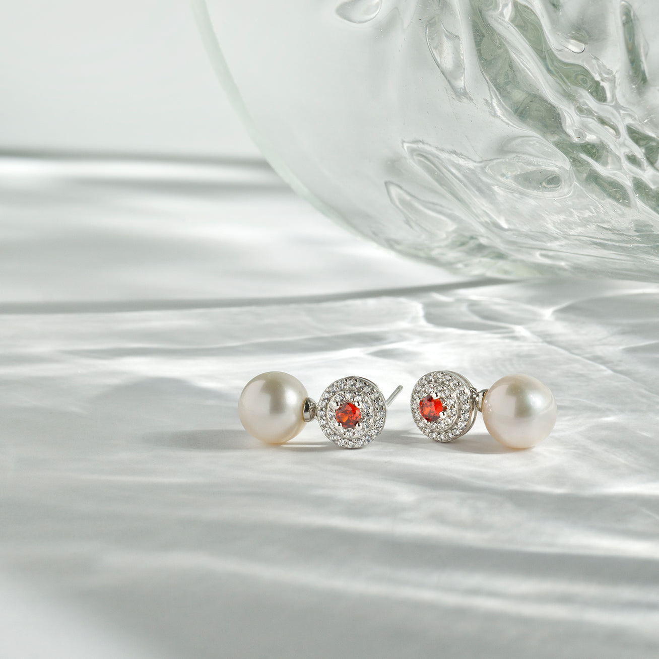 Elegant Freshwater Pearl Earrings featuring ruby red cubic zirconia, crafted in sterling silver with gold plating.