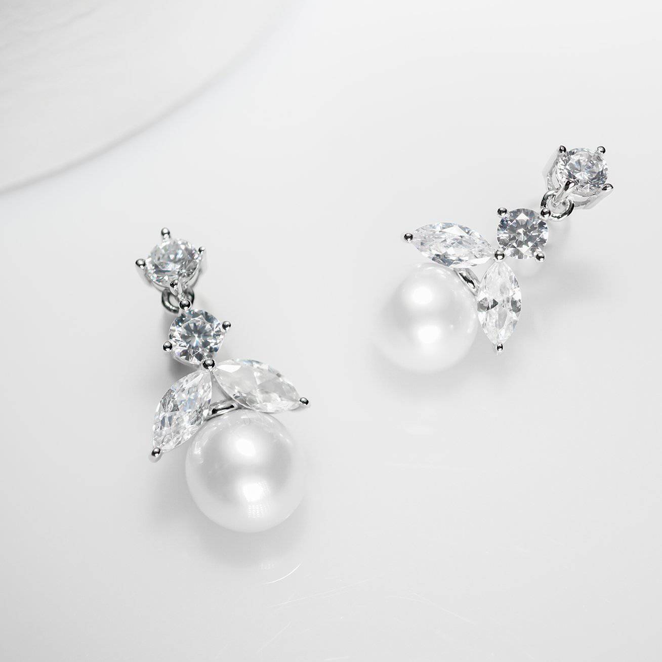 Elegant Freshwater Pearl Earrings WE00054 featuring cubic zirconia and gold-plated sterling silver, showcasing a classic drop design.