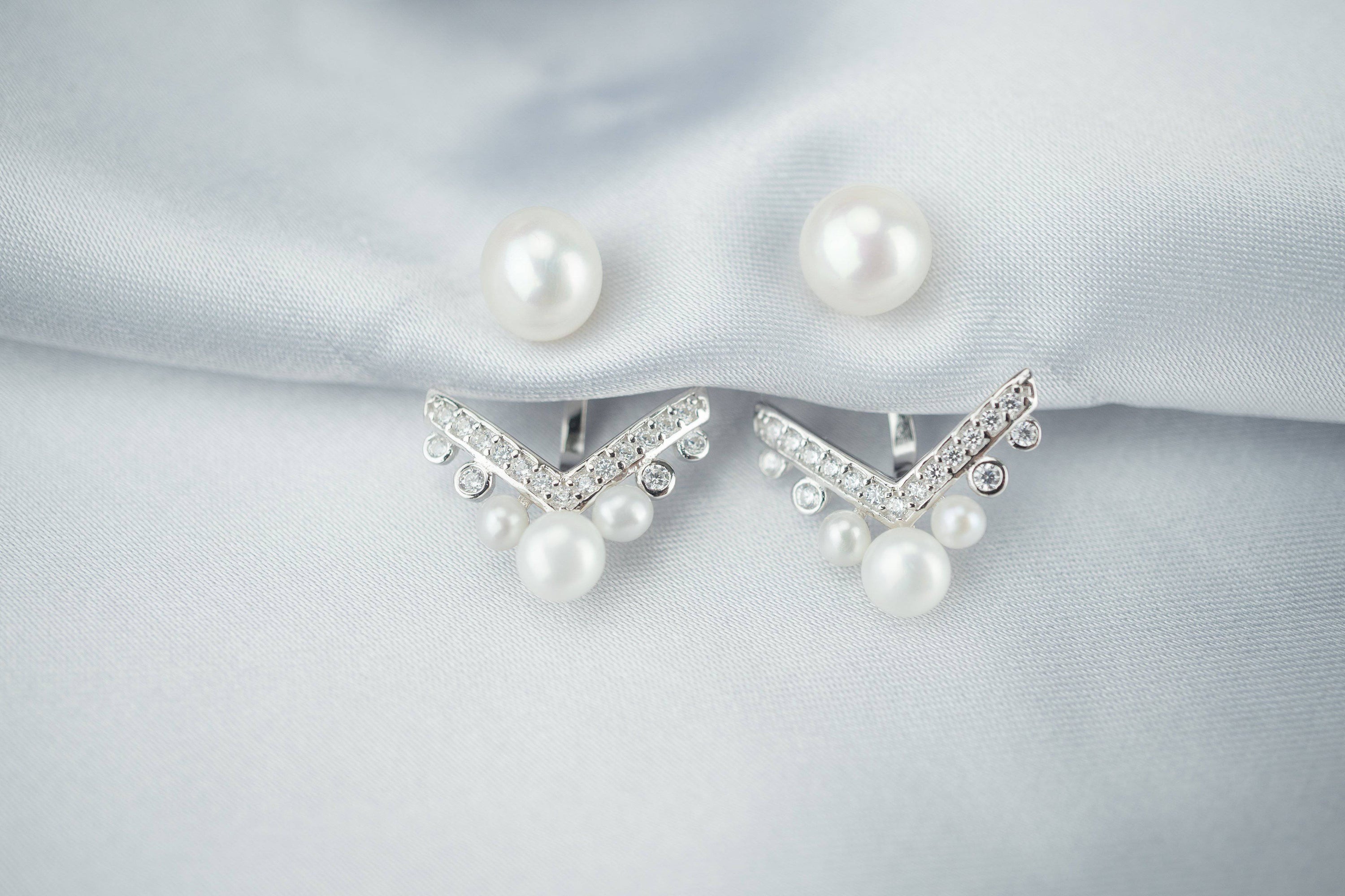 Elegant Freshwater Pearl Earrings WE00058 featuring white semi-round pearls and sterling silver with gold plating.