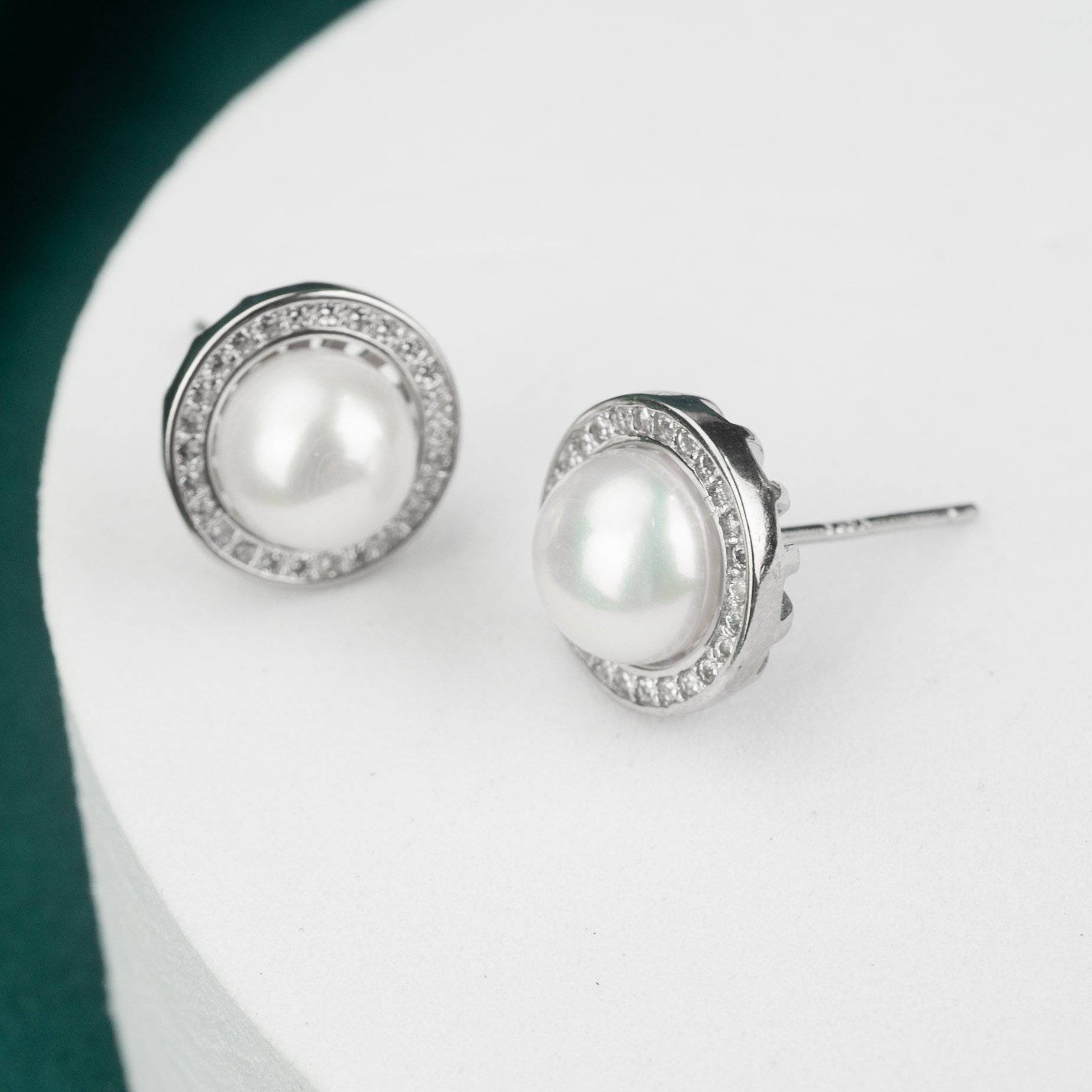 Elegant Freshwater Pearl Earrings WE00074 featuring white pearls and cubic zirconia in a sterling silver setting.