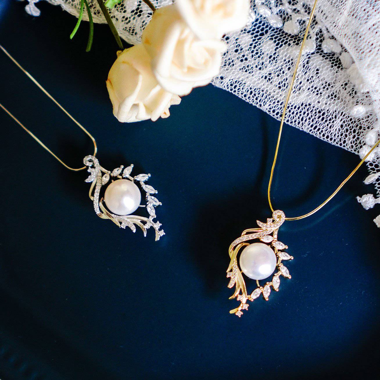 Elegant Freshwater Pearl Necklace featuring a white pearl surrounded by a gold-plated leaf design, adorned with cubic zirconia gemstones.