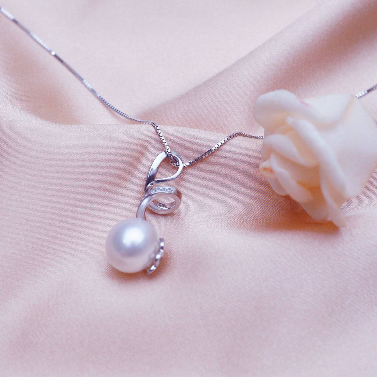 Elegant Freshwater Pearl Necklace WN00069 featuring round white pearls, cubic zirconia accents, and a gold-plated sterling silver chain.