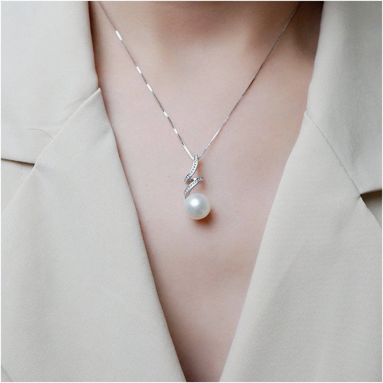 Elegant Freshwater Pearl Necklace WN00069 featuring round white pearls, cubic zirconia accents, and a gold-plated sterling silver chain.