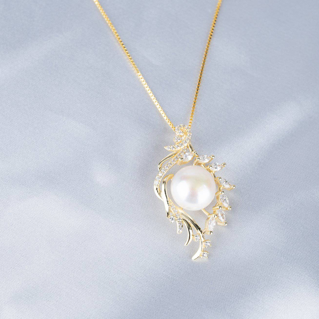 Elegant Freshwater Pearl Necklace WN00092 featuring a white pearl, gold plated sterling silver, and cubic zirconia accents in a leaf design.