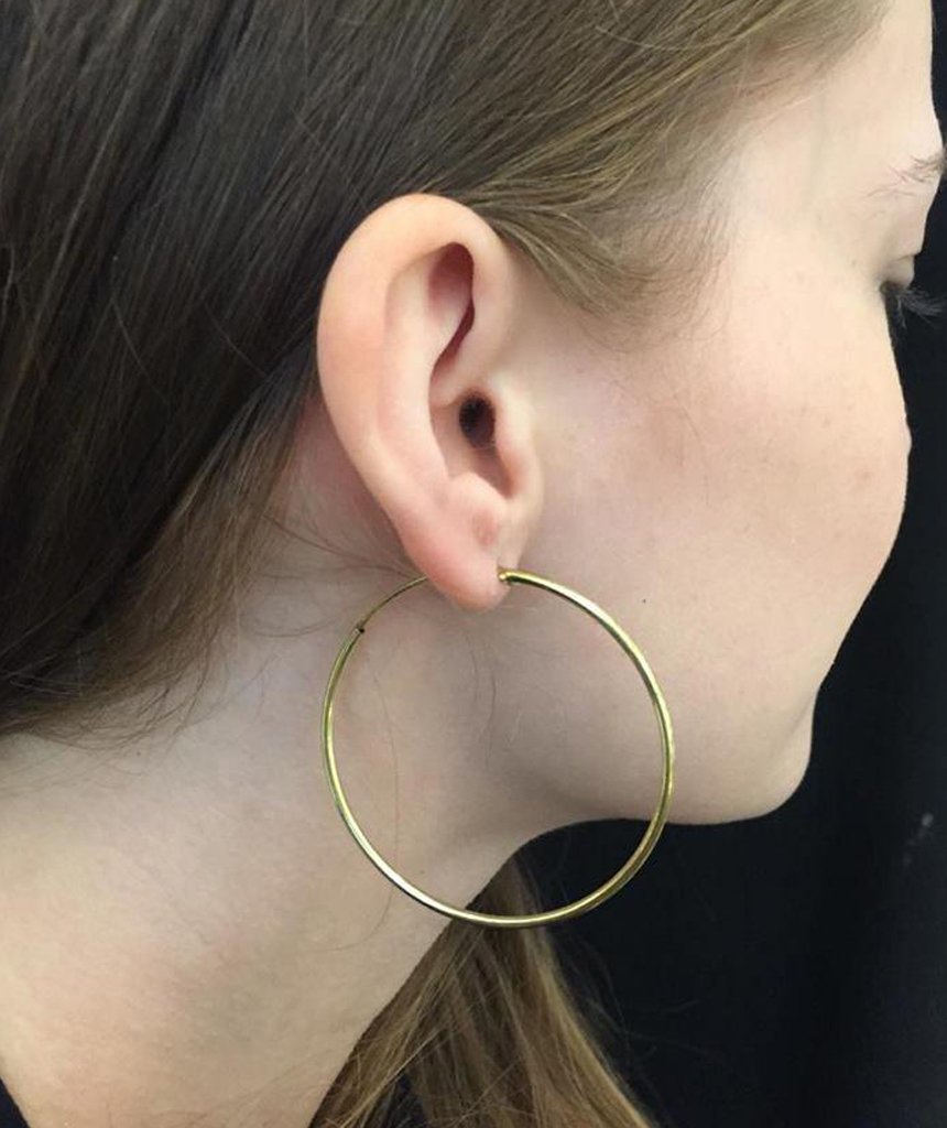 Elegant gold hoop earrings by Urbiana, handmade from brass, lightweight and hypoallergenic, perfect for sensitive skin.