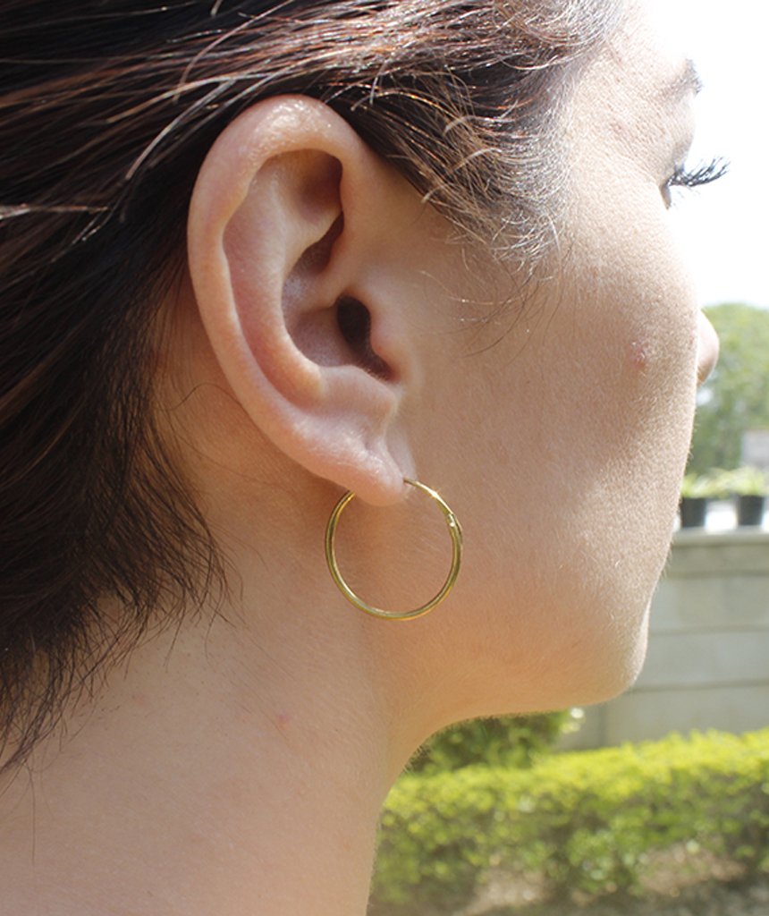 Elegant gold hoop earrings by Urbiana, handmade from brass, lightweight and hypoallergenic, perfect for sensitive skin.