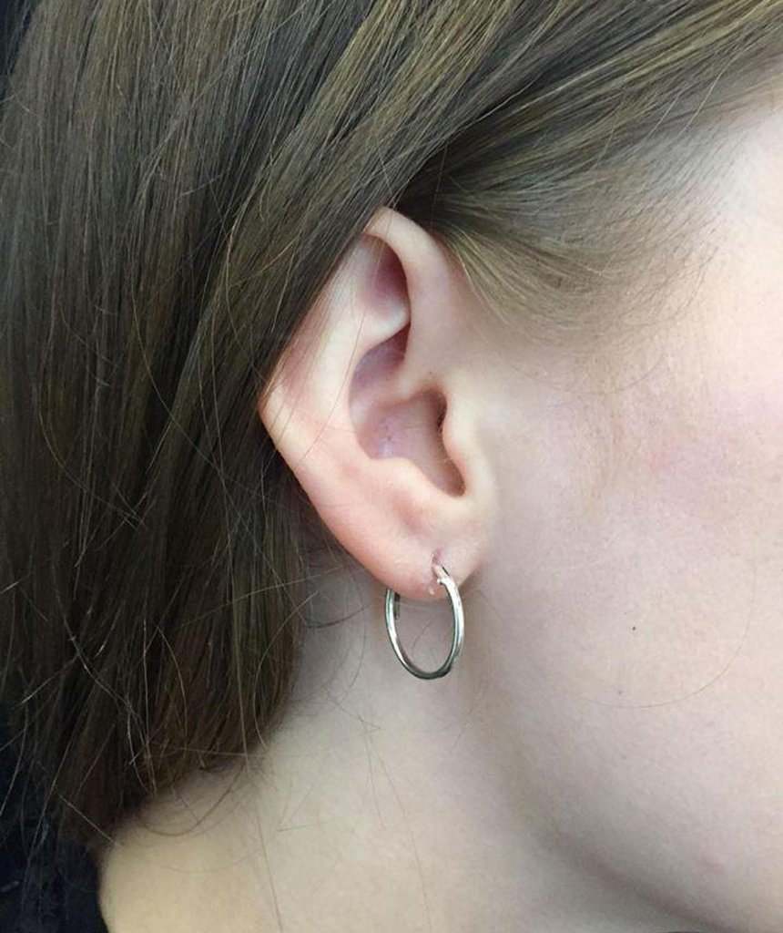 Elegant gold hoop earrings by Urbiana, handmade from brass, lightweight and hypoallergenic, perfect for sensitive skin.