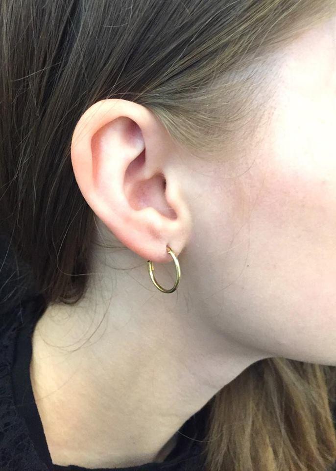 Elegant gold hoop earrings by Urbiana, handmade from brass, lightweight and hypoallergenic, perfect for sensitive skin.