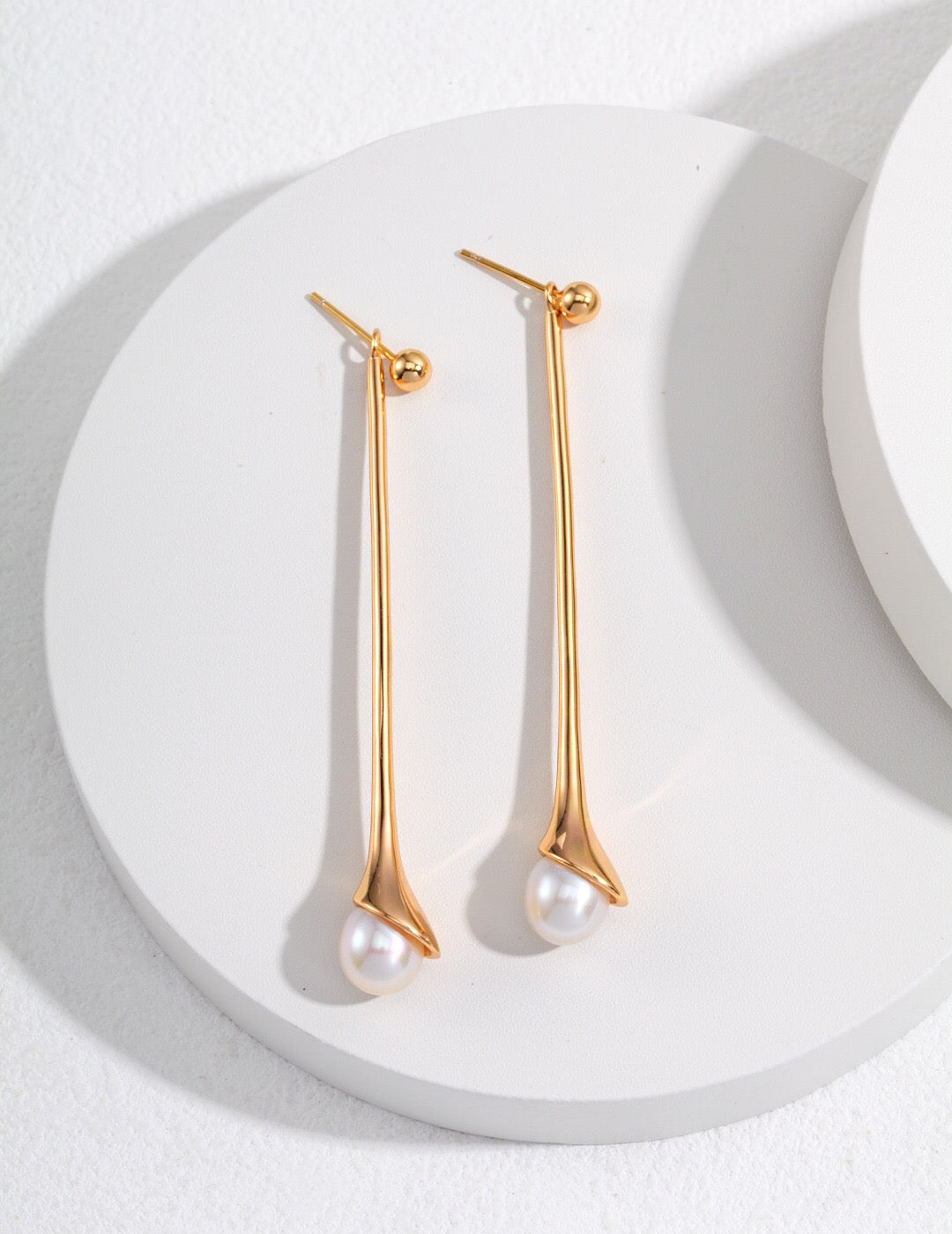 Elegant Long Pearl Drop Earrings featuring natural pearls and sterling silver with gold vermeil, showcasing a sophisticated drop design.