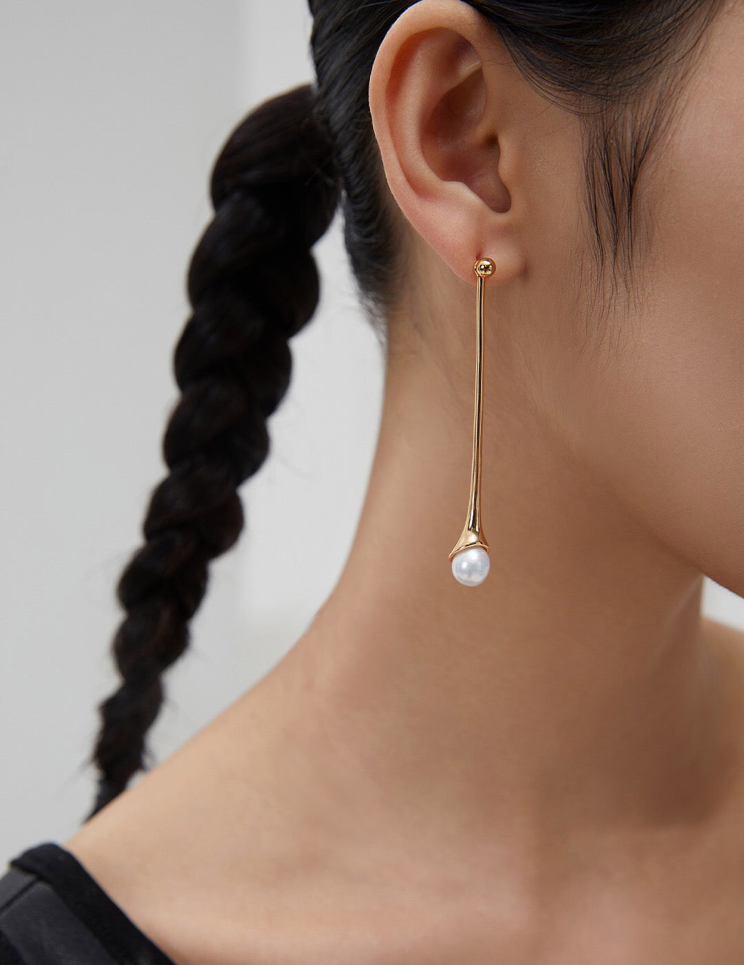 Elegant Long Pearl Drop Earrings featuring natural pearls and sterling silver with gold vermeil, showcasing a sophisticated drop design.