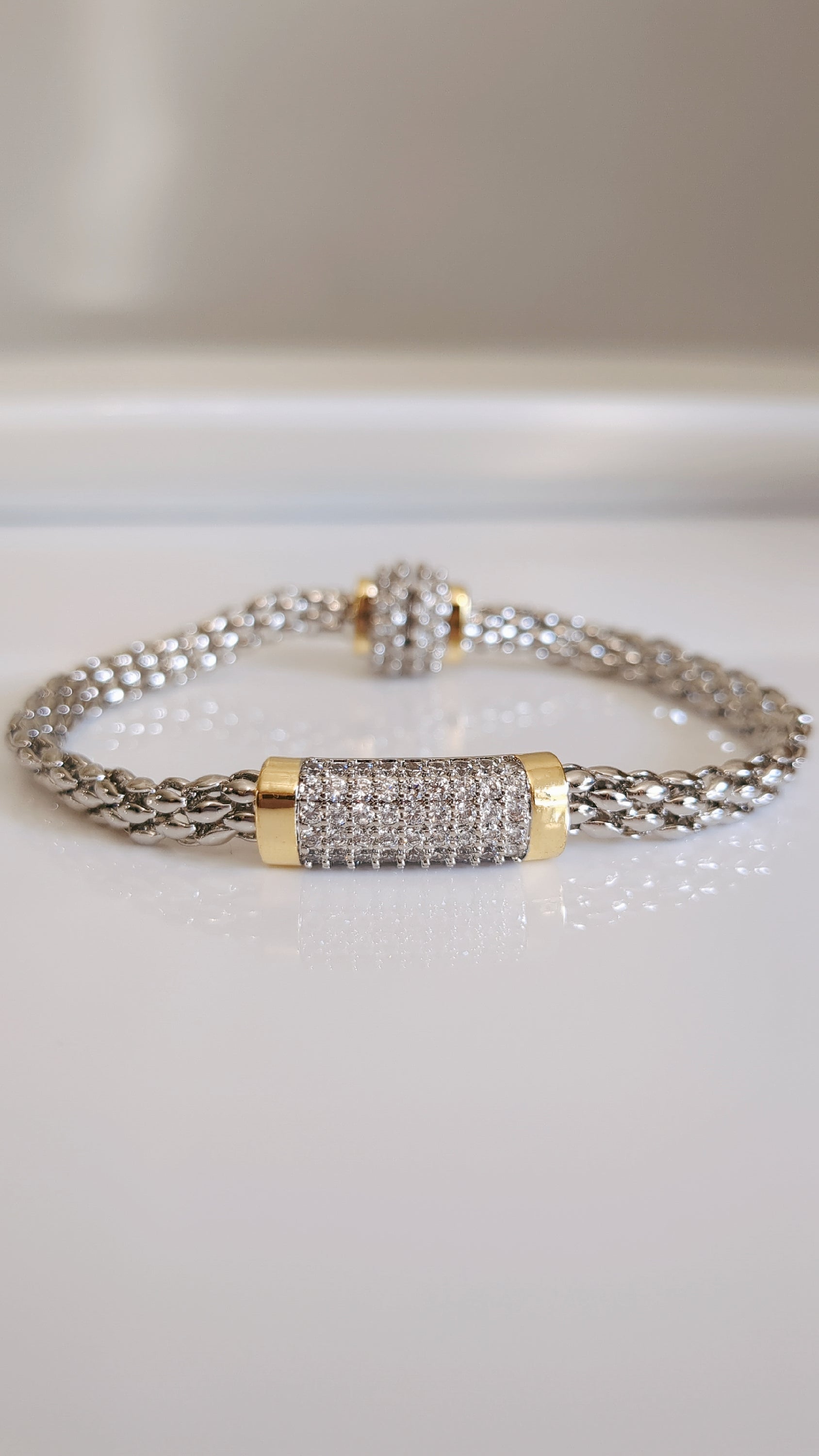 Elegant Magnetic Bracelet featuring a delicate cable pattern and rhodium plating, perfect for stacking or everyday wear.