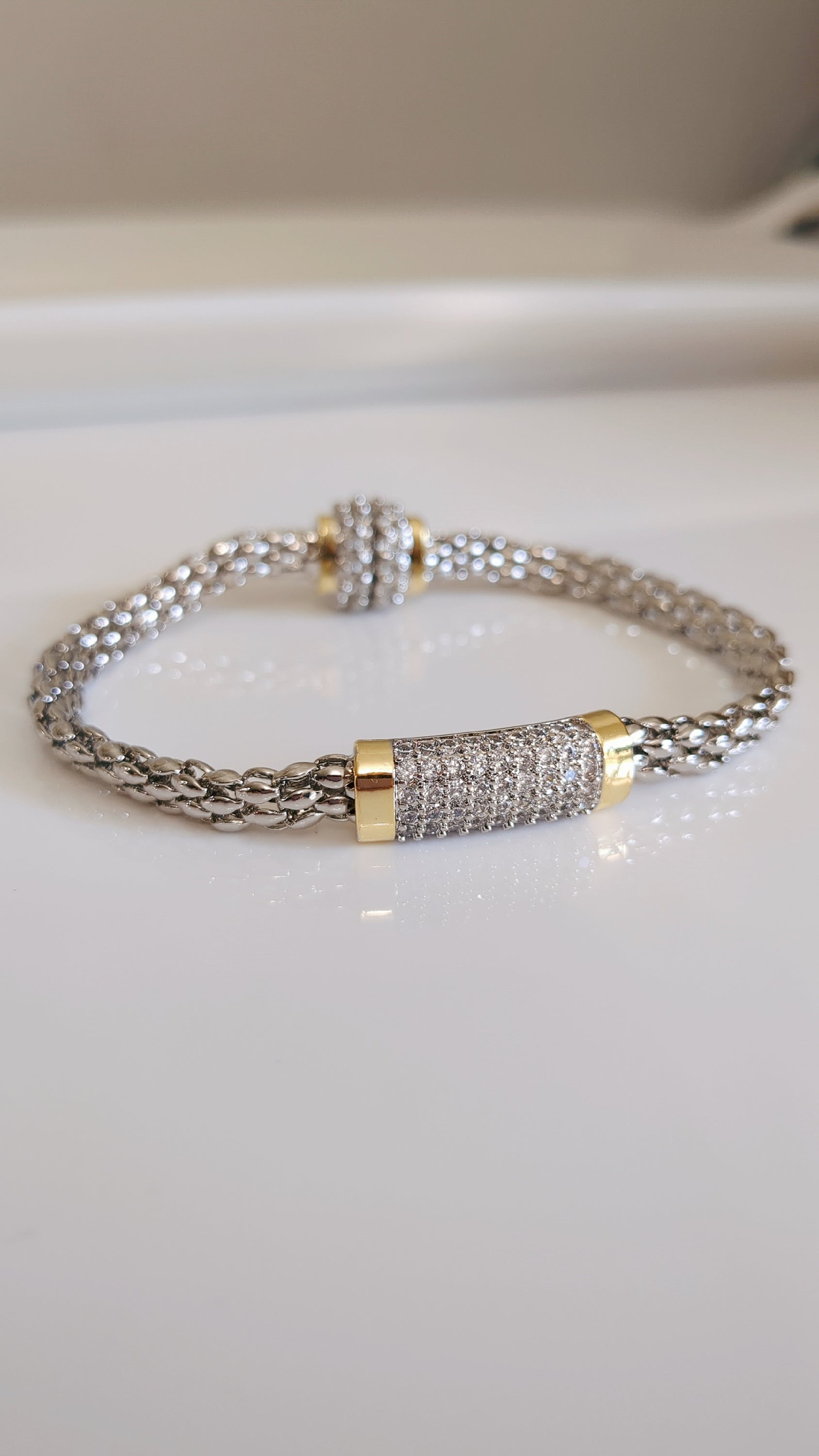 Elegant Magnetic Bracelet featuring a delicate cable pattern and rhodium plating, perfect for stacking or everyday wear.