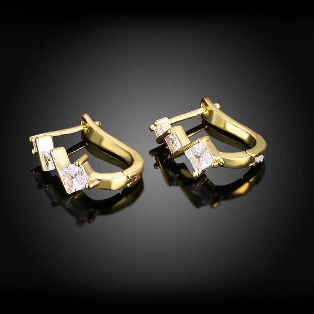 Elements Criss-Cross Clip On Earrings featuring certified crystals and 18K gold plating, elegantly designed for comfort and style.