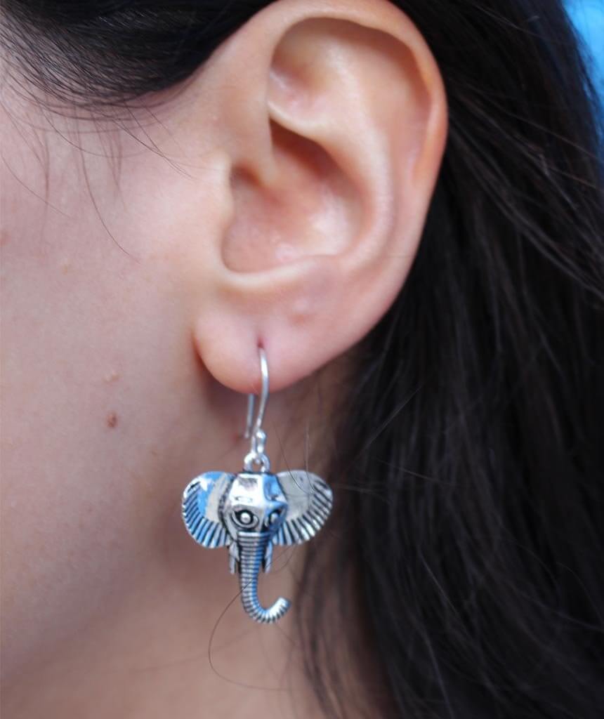 A pair of Indian style elephant earrings made of brass, featuring intricate detailing and a lightweight design, perfect for animal jewelry lovers.