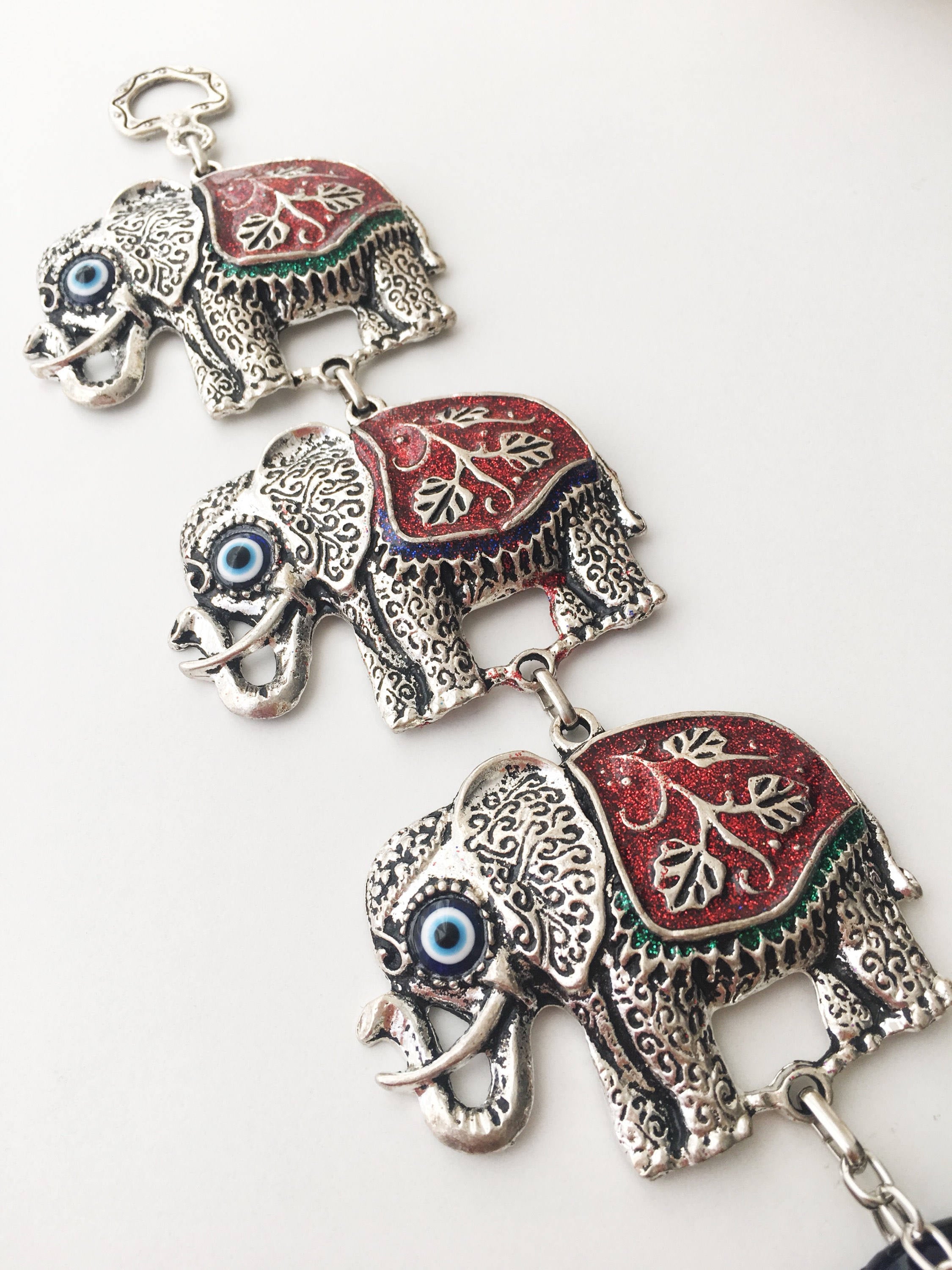 Handmade Elephant Evil Eye Wall Decor featuring a blue evil eye and colorful elephant charm, symbolizing protection and good luck.