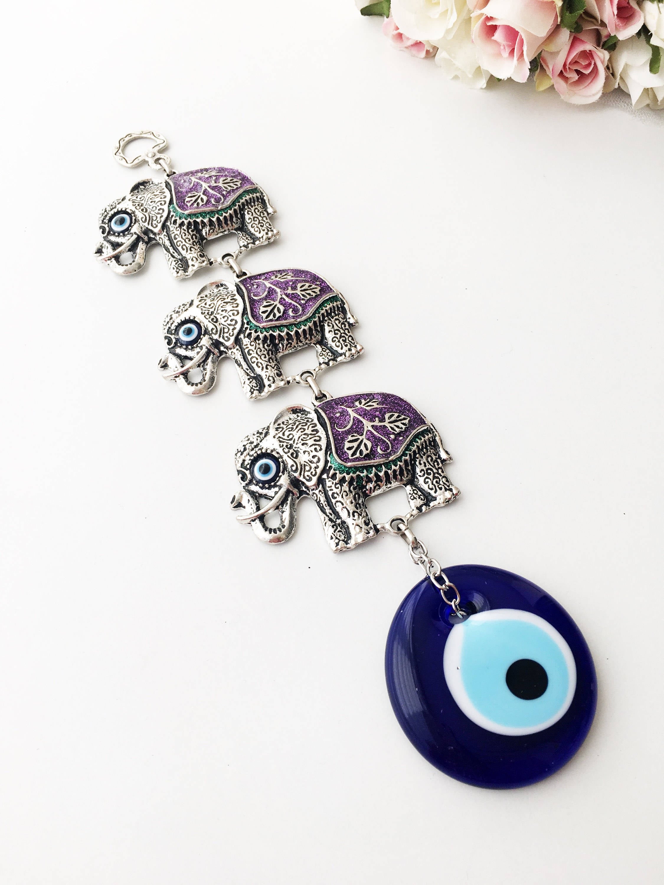 Handmade Elephant Evil Eye Wall Decor featuring a blue evil eye and colorful elephant charm, symbolizing protection and good luck.