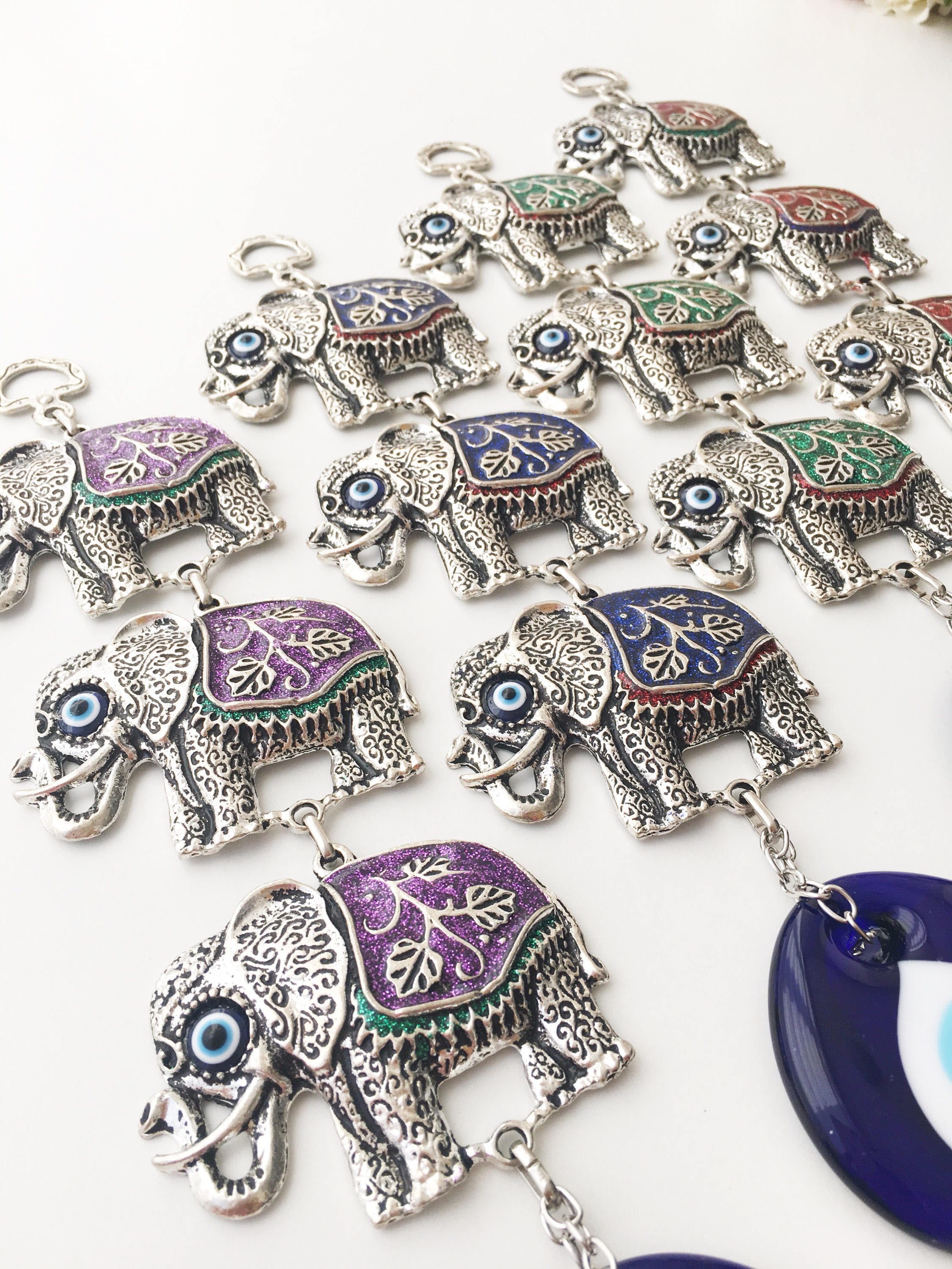 Handmade Elephant Evil Eye Wall Decor featuring a blue evil eye and colorful elephant charm, symbolizing protection and good luck.