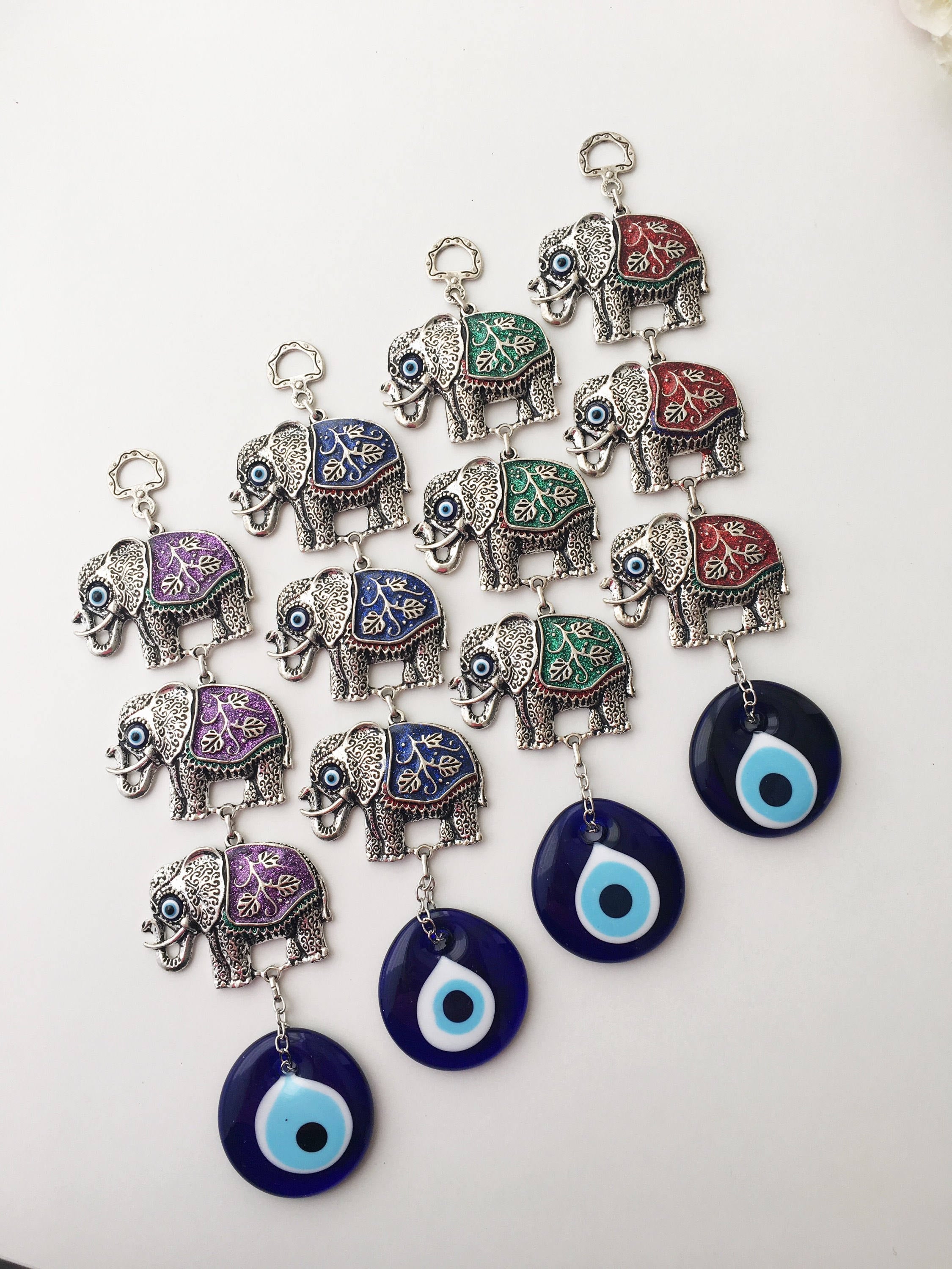 Handmade Elephant Evil Eye Wall Decor featuring a blue evil eye and colorful elephant charm, symbolizing protection and good luck.