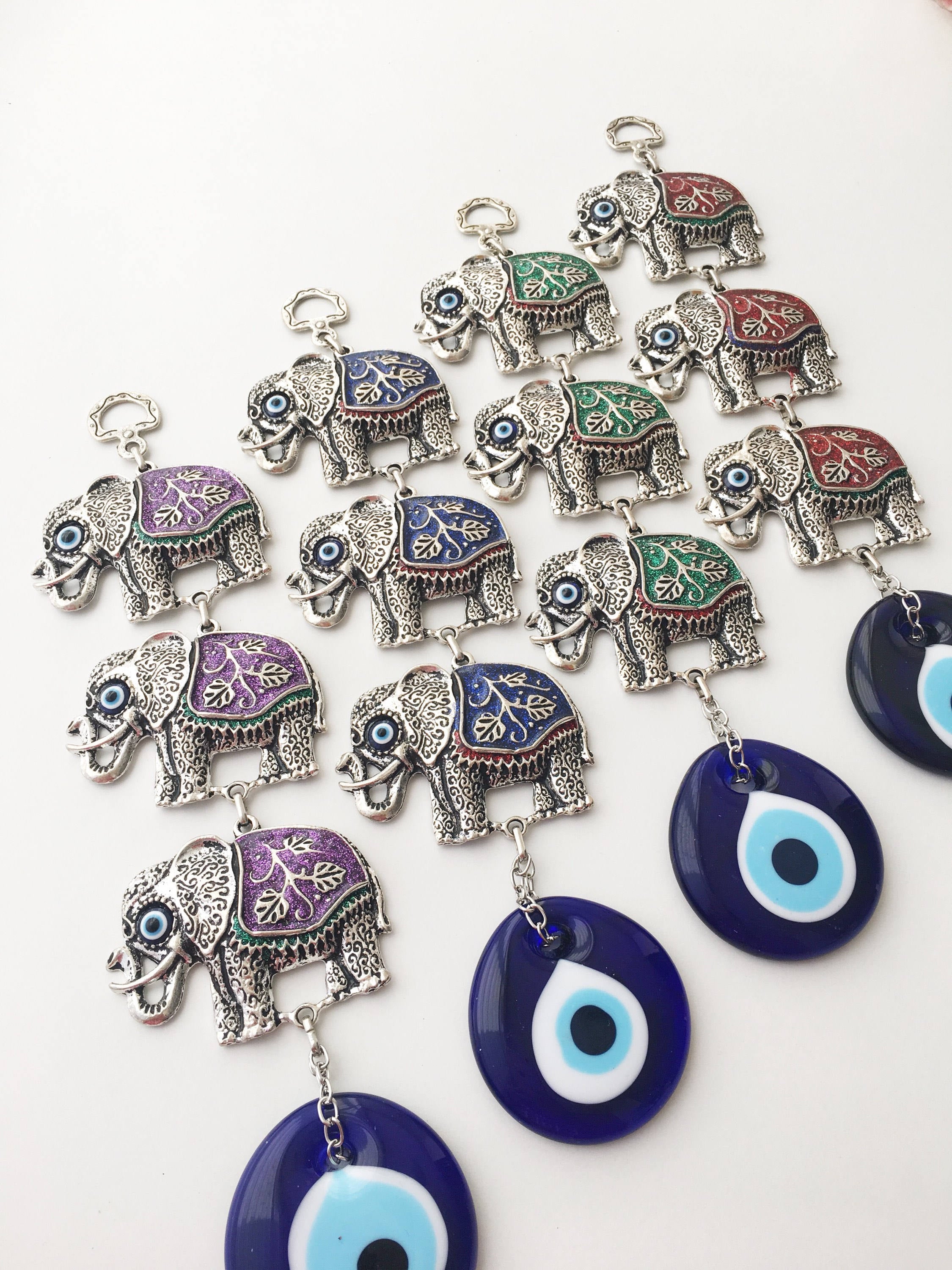 Handmade Elephant Evil Eye Wall Decor featuring a blue evil eye and colorful elephant charm, symbolizing protection and good luck.