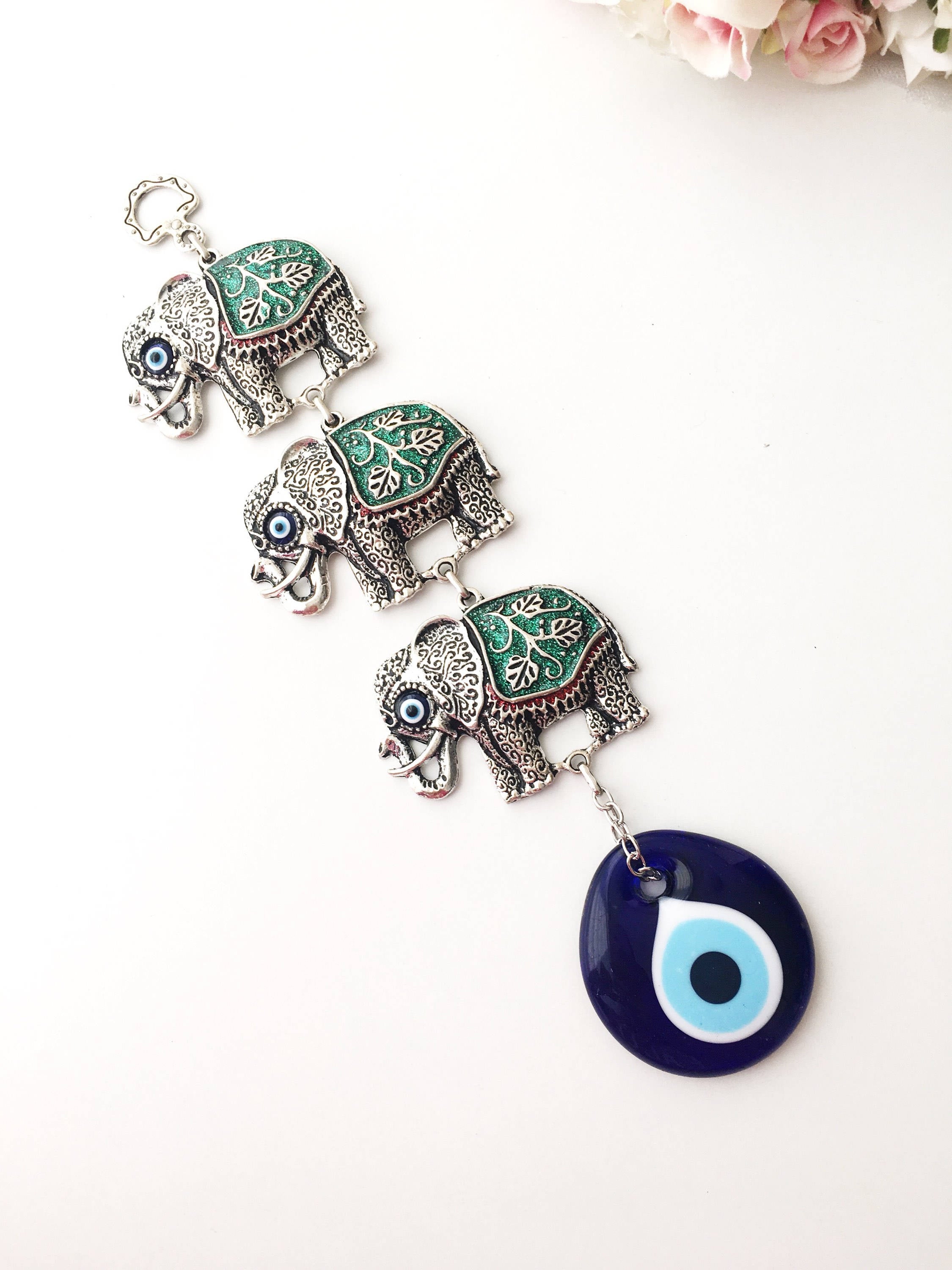 Handmade Elephant Evil Eye Wall Decor featuring a blue evil eye and colorful elephant charm, symbolizing protection and good luck.