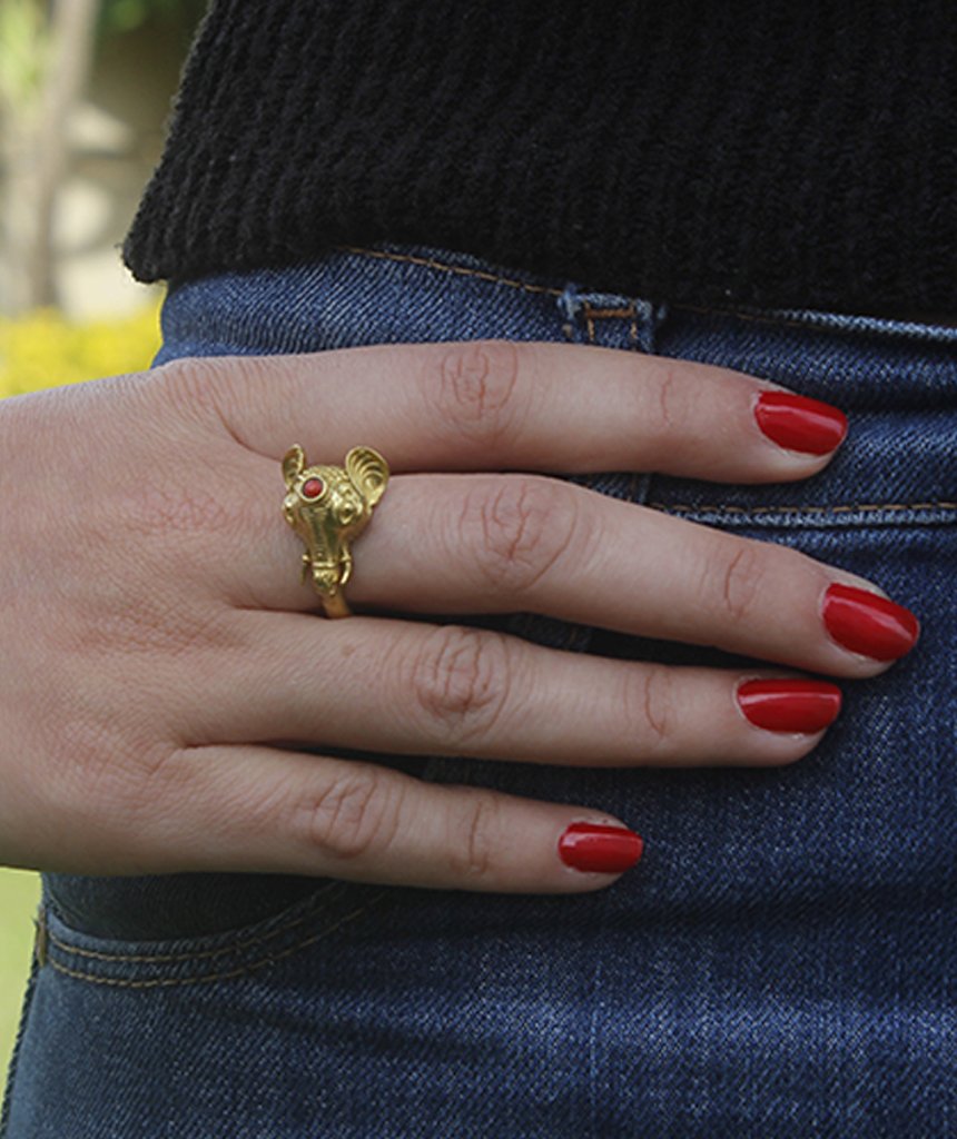 A beautifully crafted elephant ring featuring a semi precious stone, available in gold and silver finishes, showcasing intricate details.