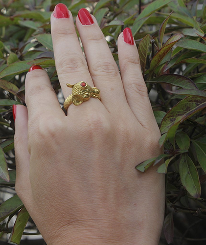 A beautifully crafted elephant ring featuring a semi precious stone, available in gold and silver finishes, showcasing intricate details.