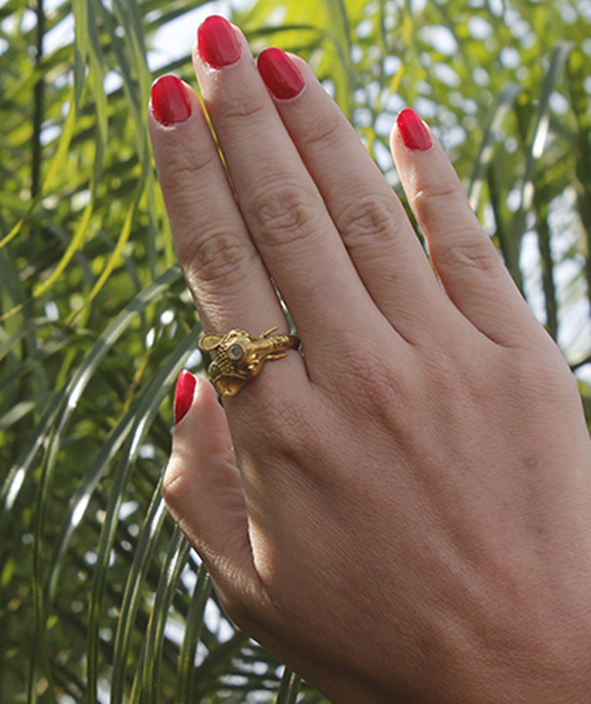 A beautifully crafted elephant ring featuring a semi precious stone, available in gold and silver finishes, showcasing intricate details.