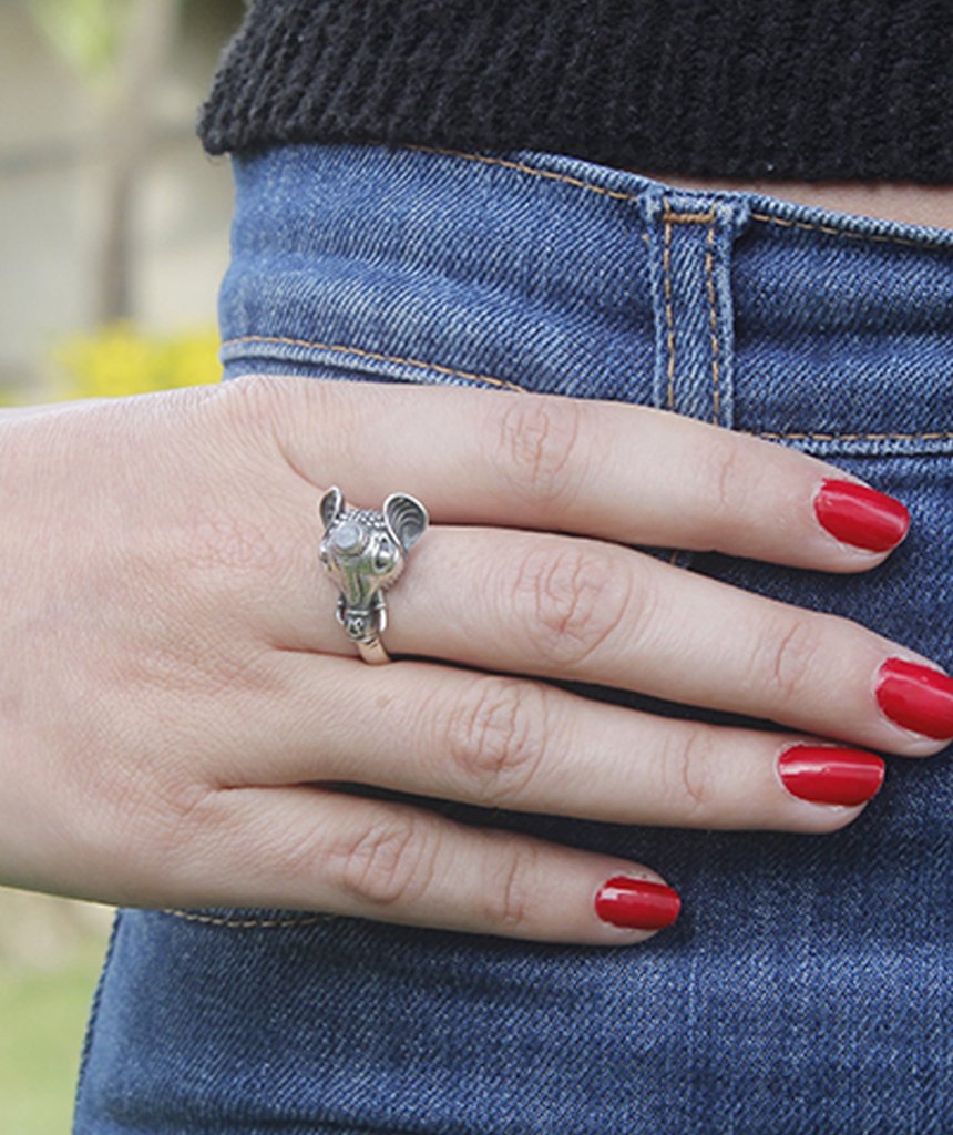 A beautifully crafted elephant ring featuring a semi precious stone, available in gold and silver finishes, showcasing intricate details.