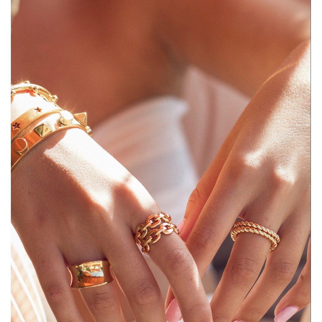 Eli Twist Ring featuring a stylish twist design, 18k gold plated over stainless steel, perfect for any occasion.