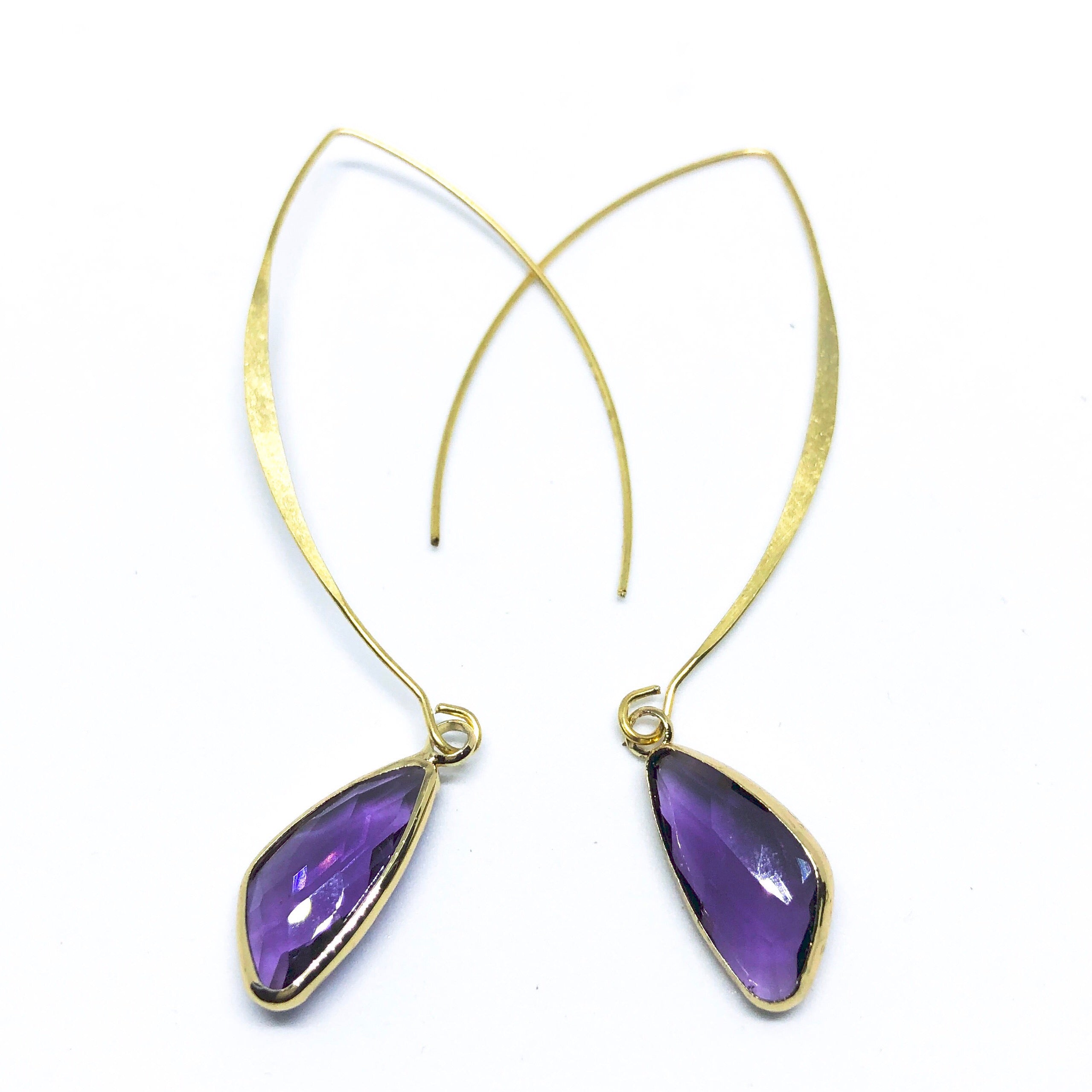 Elise Arc Earrings in gold and silver, showcasing their elegant dangle design and vibrant color options.