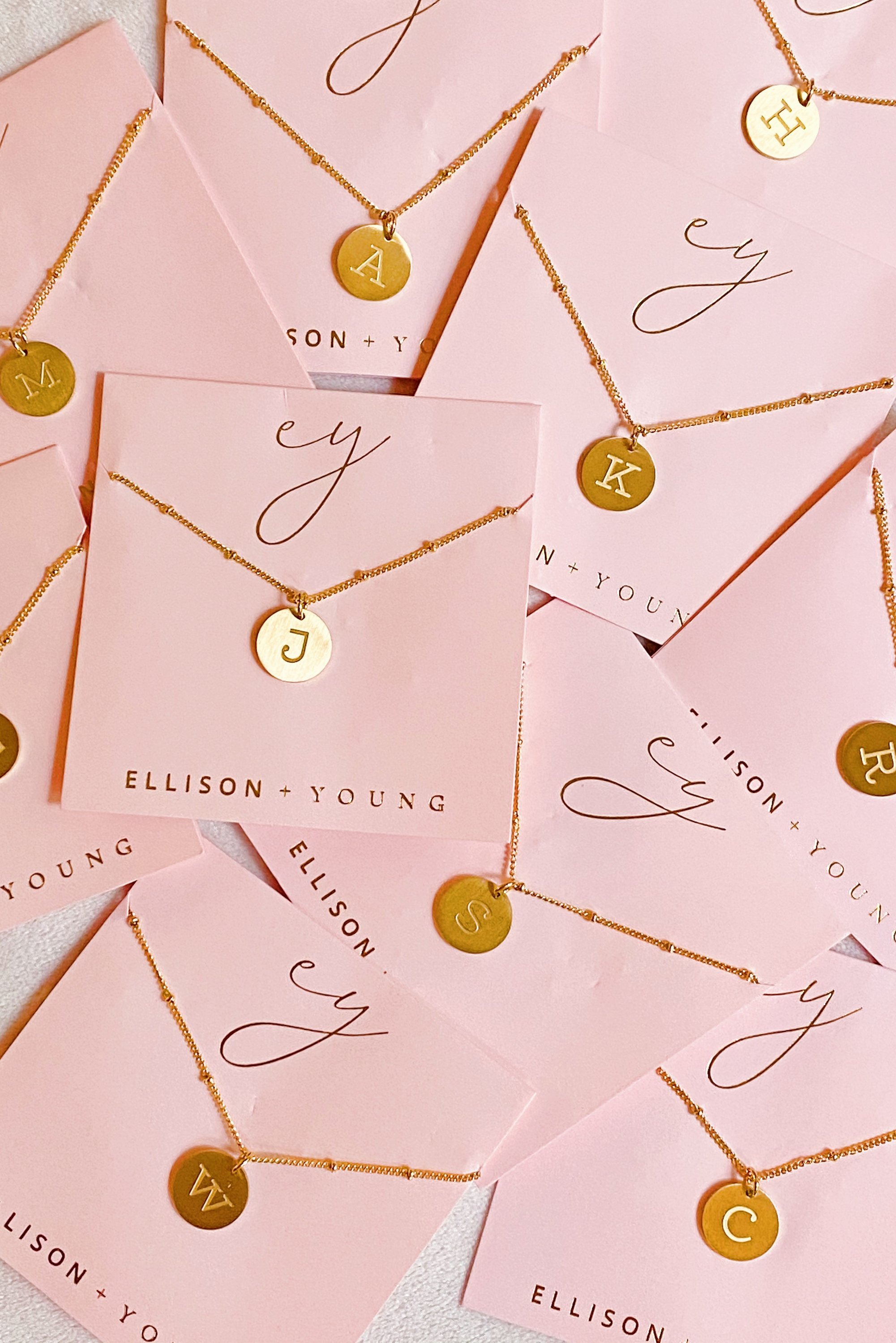 Elegant gold coin initial necklace by Ellison + Young featuring a personalized charm.