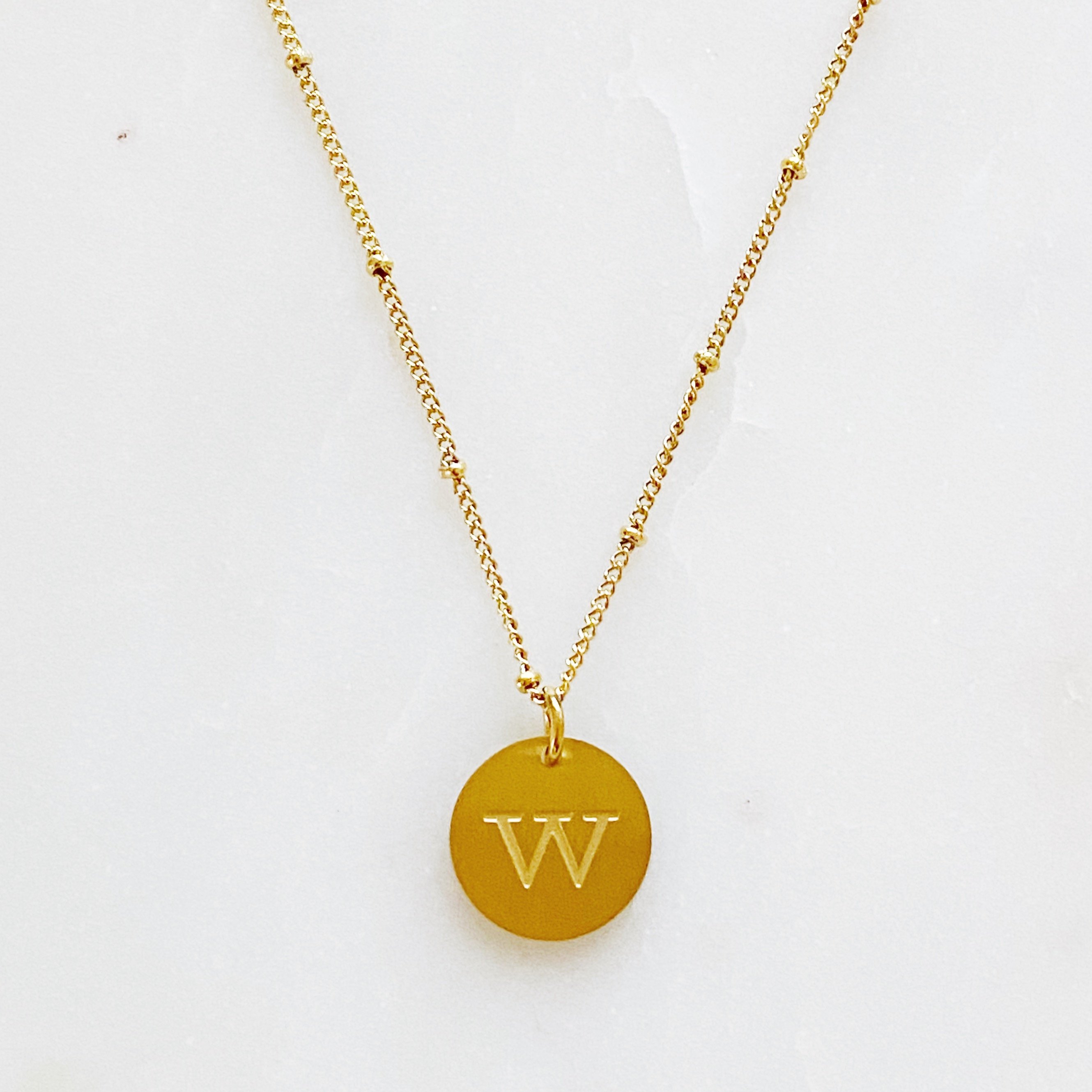 Elegant gold coin initial necklace by Ellison + Young featuring a personalized charm.