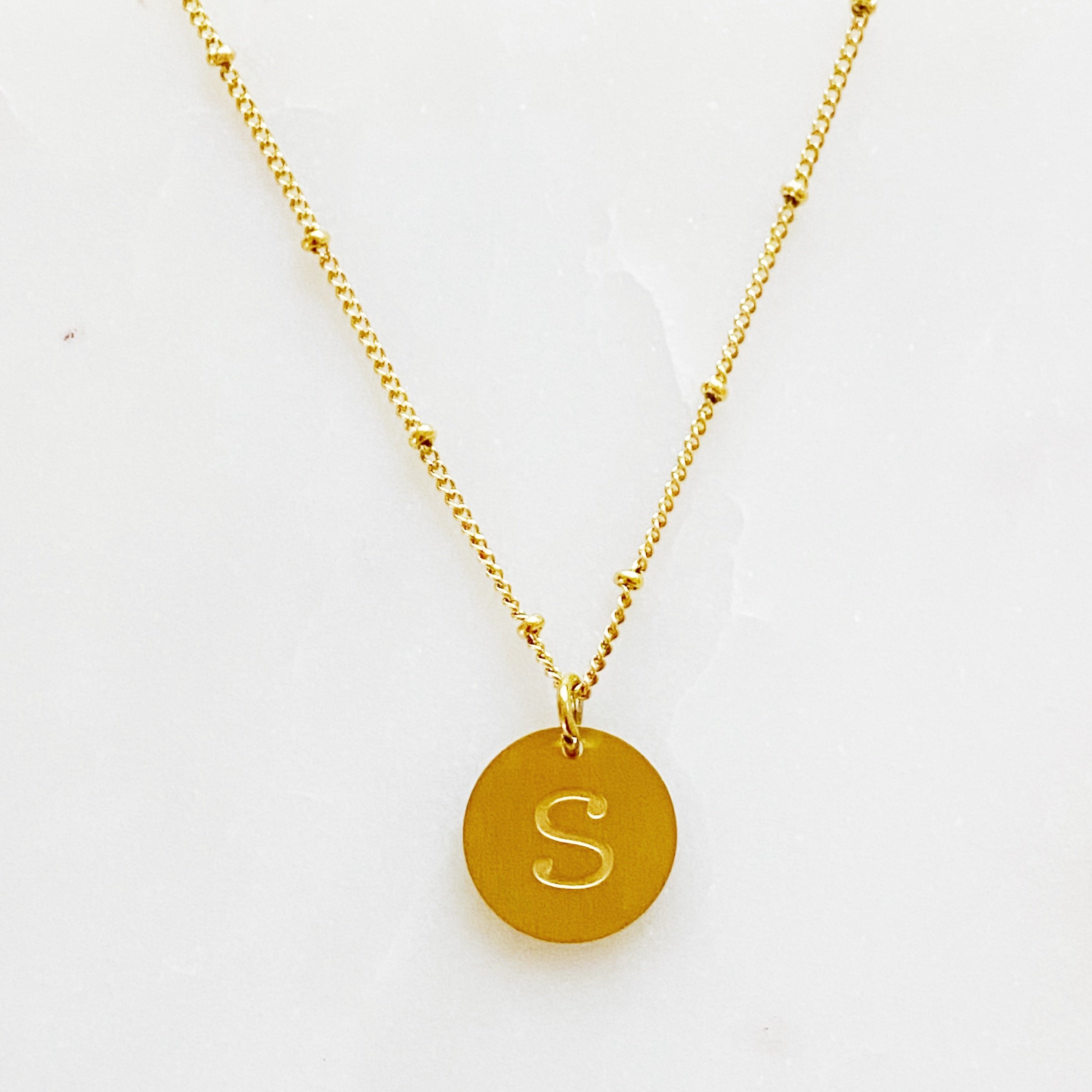 Elegant gold coin initial necklace by Ellison + Young featuring a personalized charm.