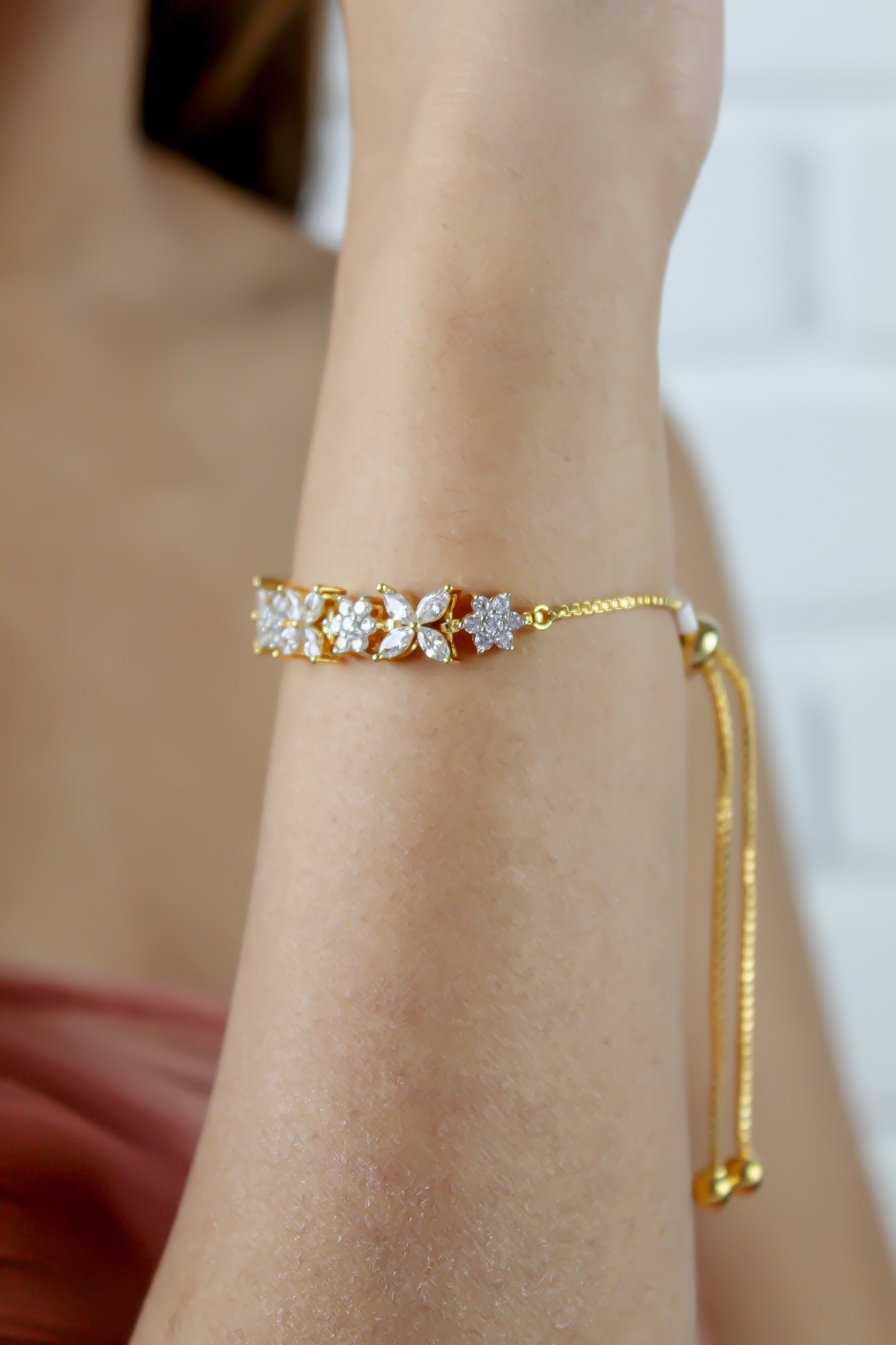 Elegant Elsa Bracelet featuring 18k gold or silver plating with authentic zircons, adjustable design for a perfect fit.