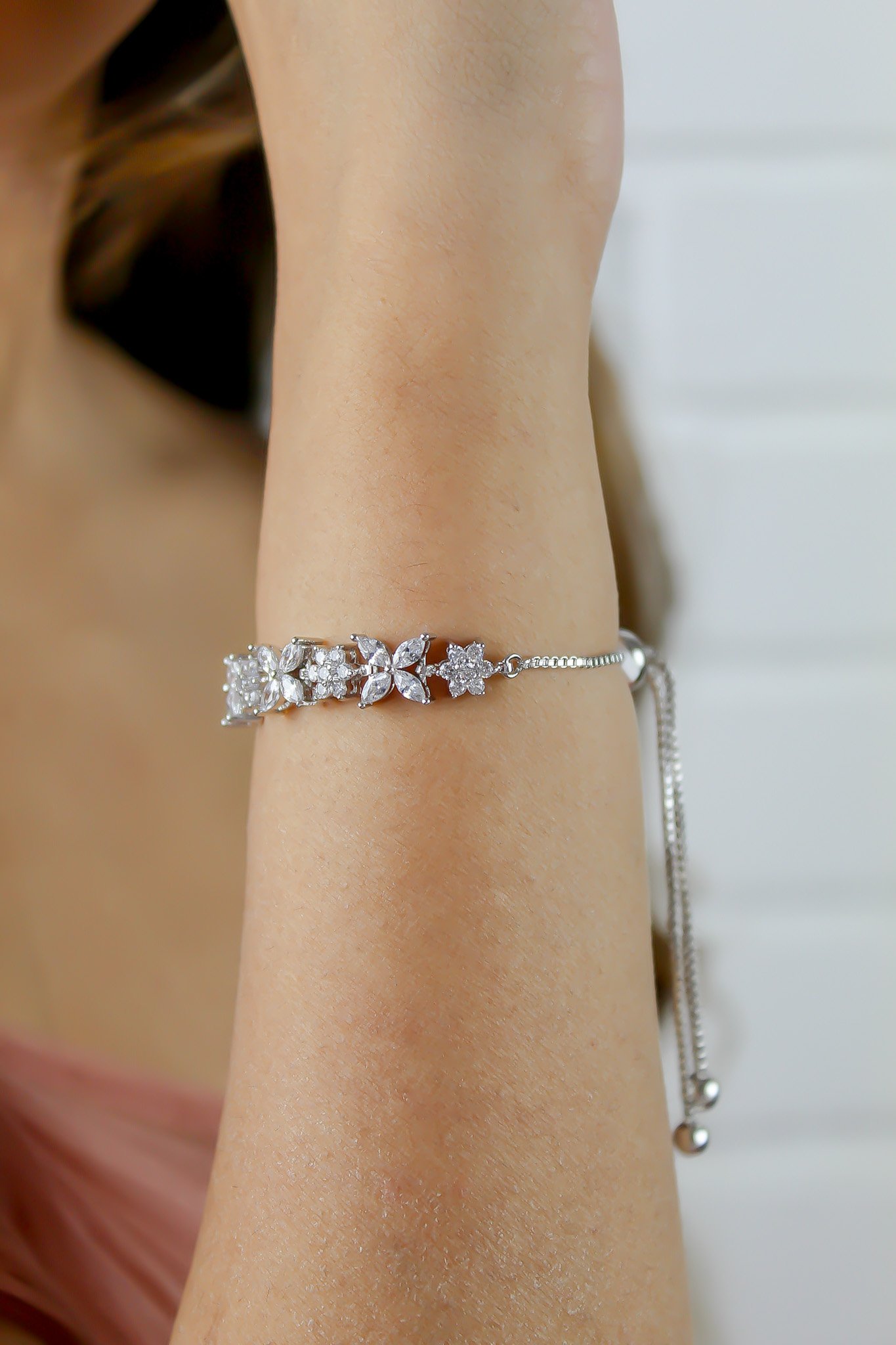 Elegant Elsa Bracelet featuring 18k gold or silver plating with authentic zircons, adjustable design for a perfect fit.