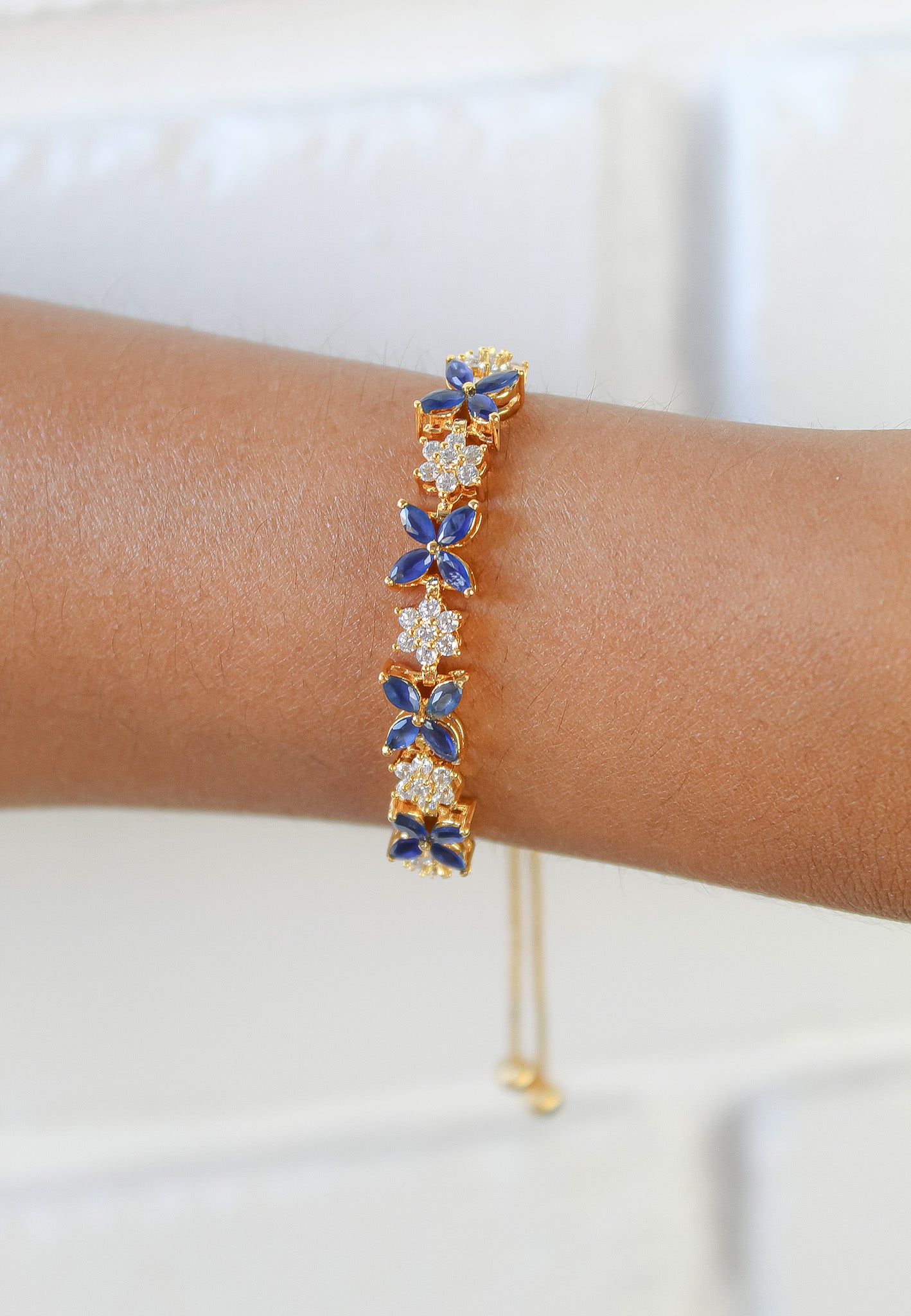 Elegant Elsa Bracelet featuring 18k gold or silver plating with authentic zircons, adjustable design for a perfect fit.