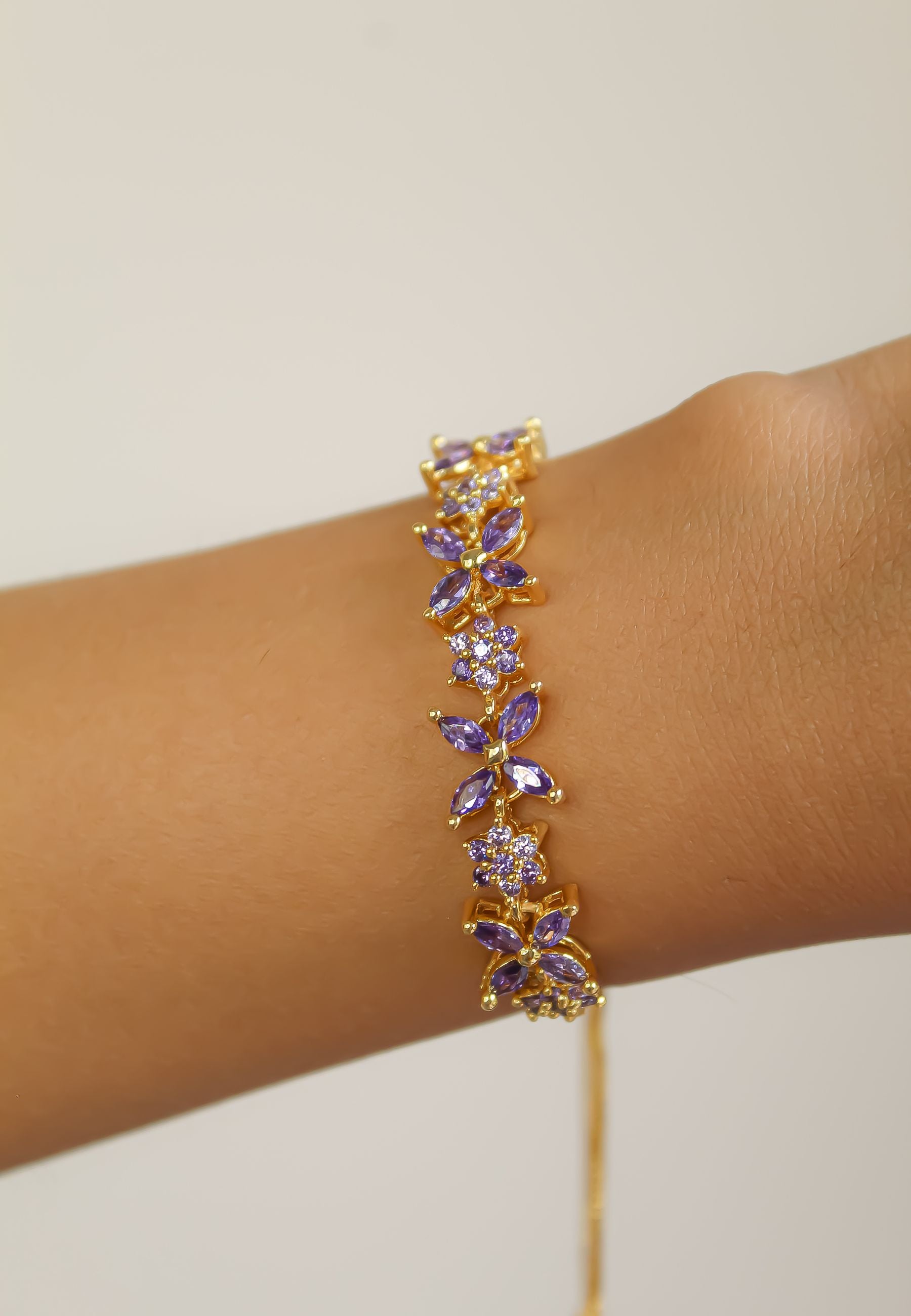 Elegant Elsa Bracelet featuring 18k gold or silver plating with authentic zircons, adjustable design for a perfect fit.