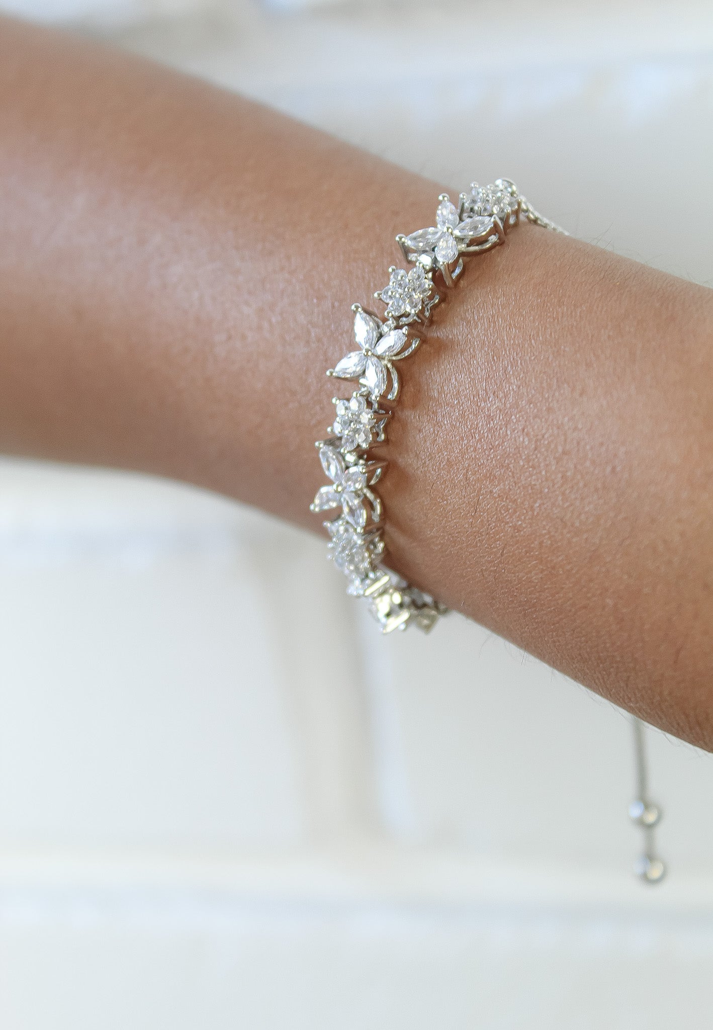 Elegant Elsa Bracelet featuring 18k gold or silver plating with authentic zircons, adjustable design for a perfect fit.