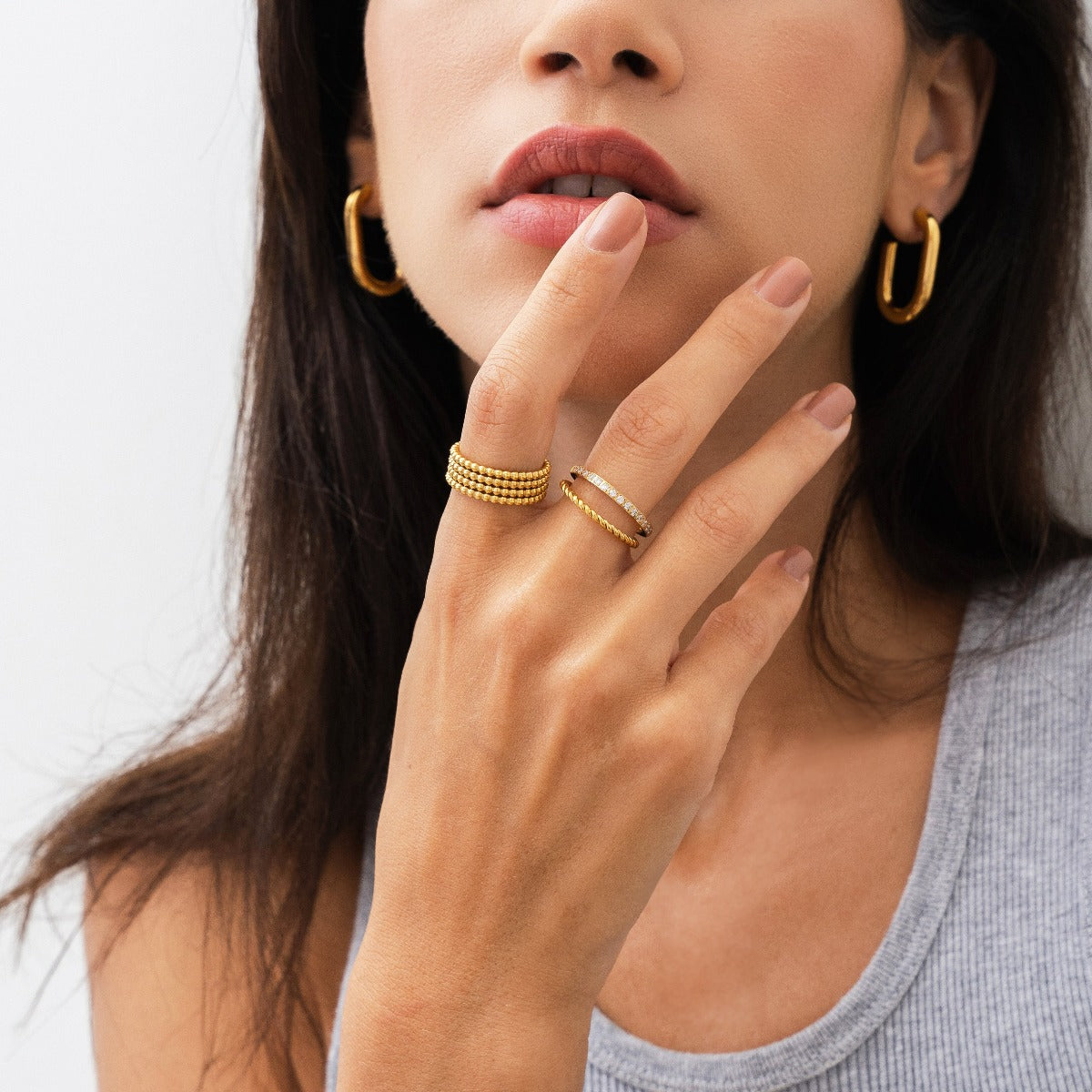 Eman Larissa Layered Ring in gold, showcasing its elegant layered design and premium finish.