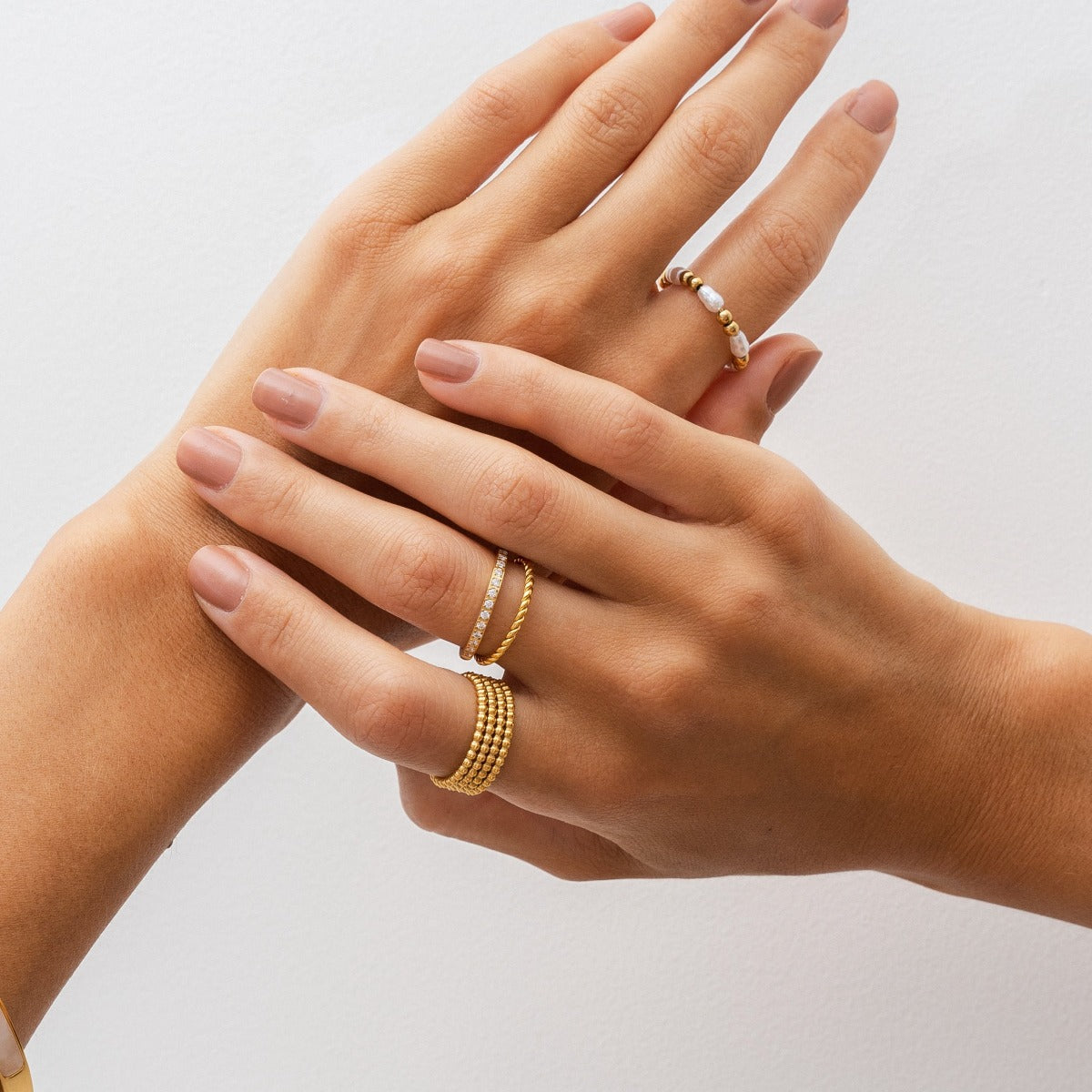 Eman Larissa Layered Ring in gold, showcasing its elegant layered design and premium finish.