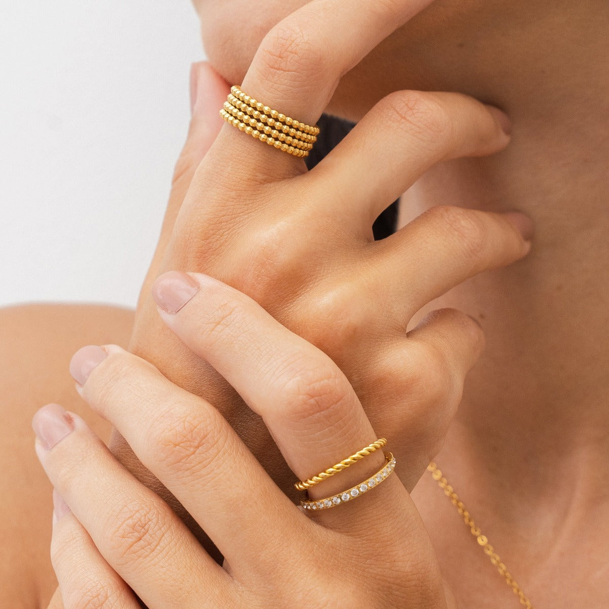 Eman Larissa Layered Ring in gold, showcasing its elegant layered design and premium finish.